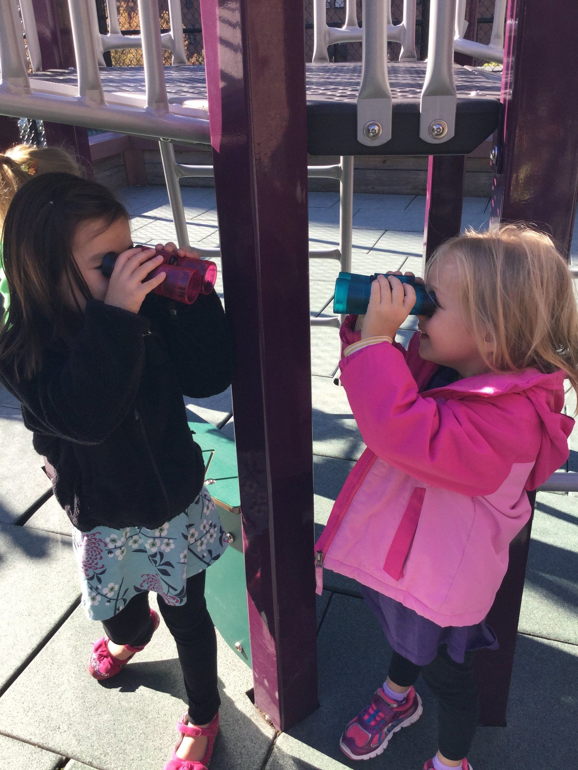 students at play with binoculars 