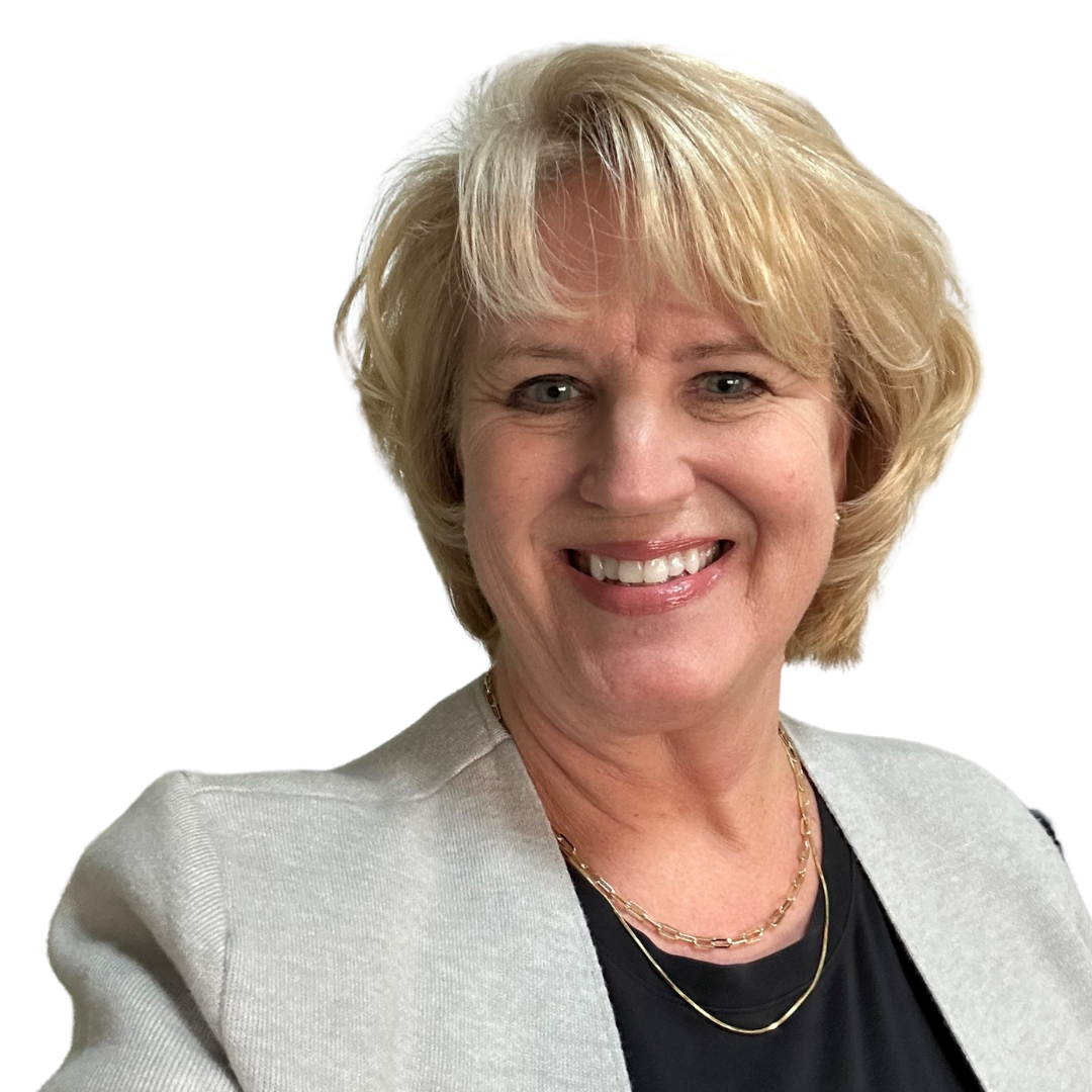 A woman in a suit and white shirt is smiling for the camera.