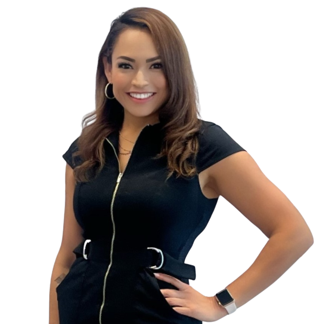 A woman in a suit and white shirt smiles for the camera