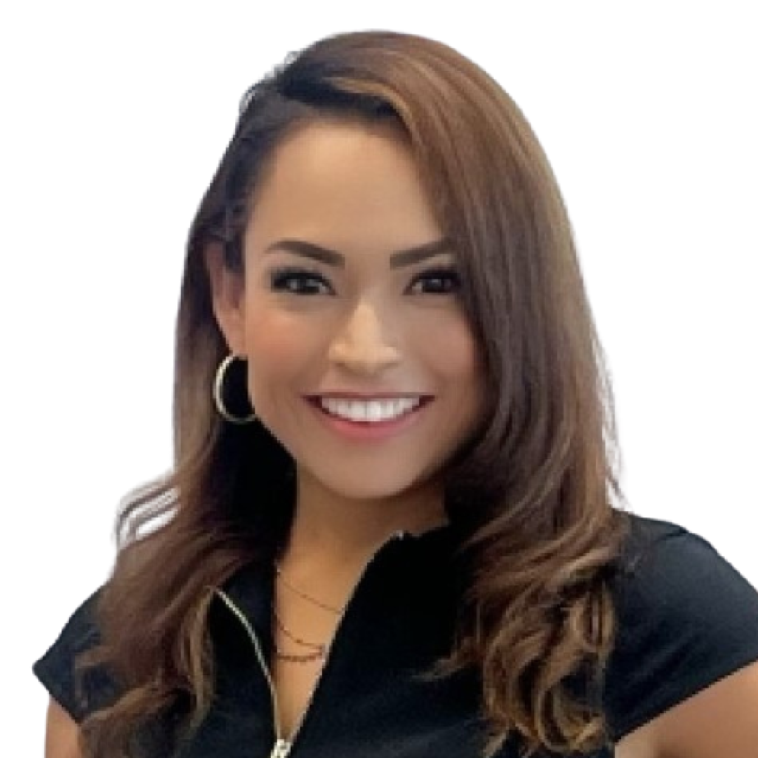 A woman in a suit and white shirt smiles for the camera