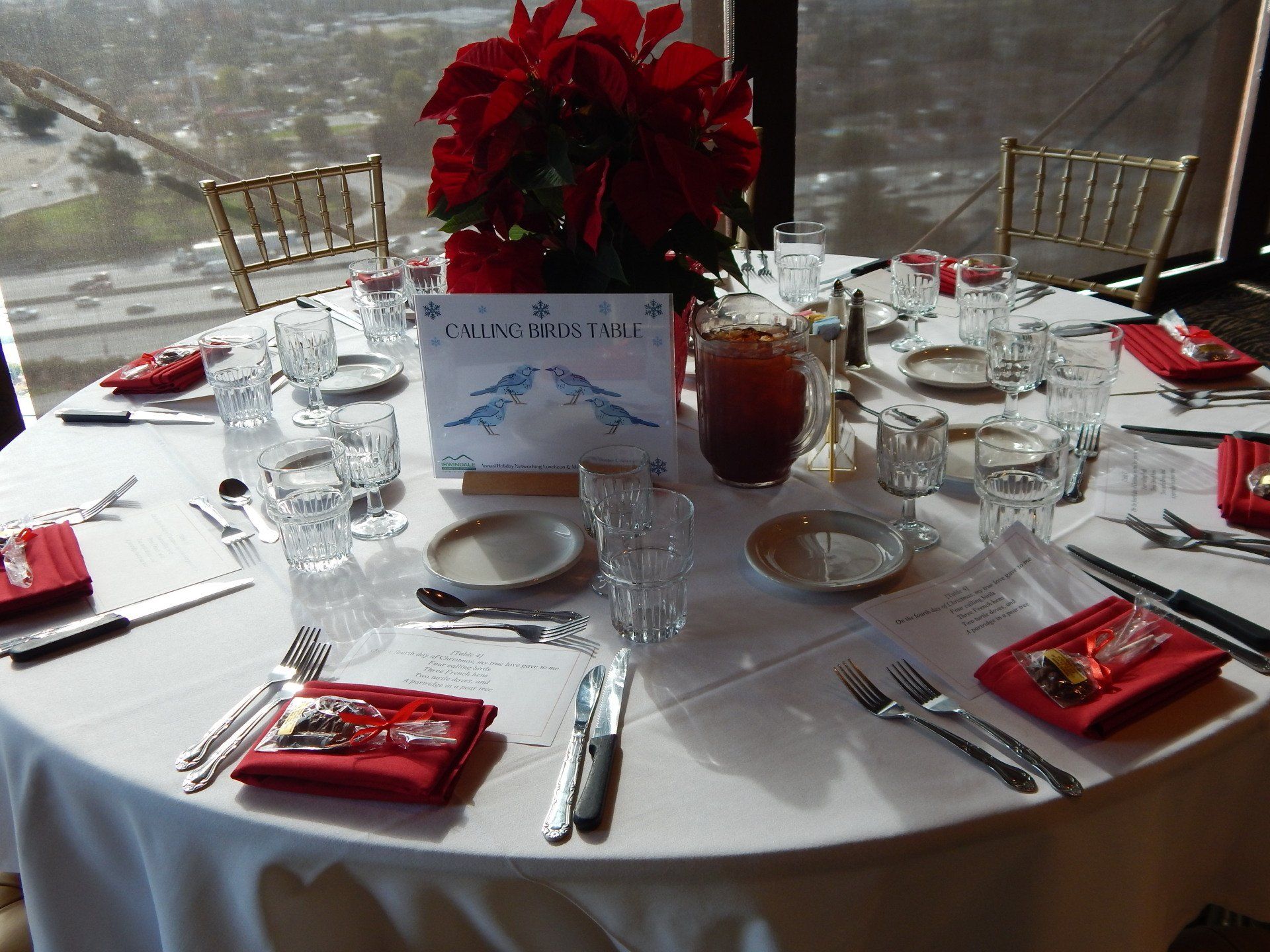 A table set for a dinner with a sign that says welcome