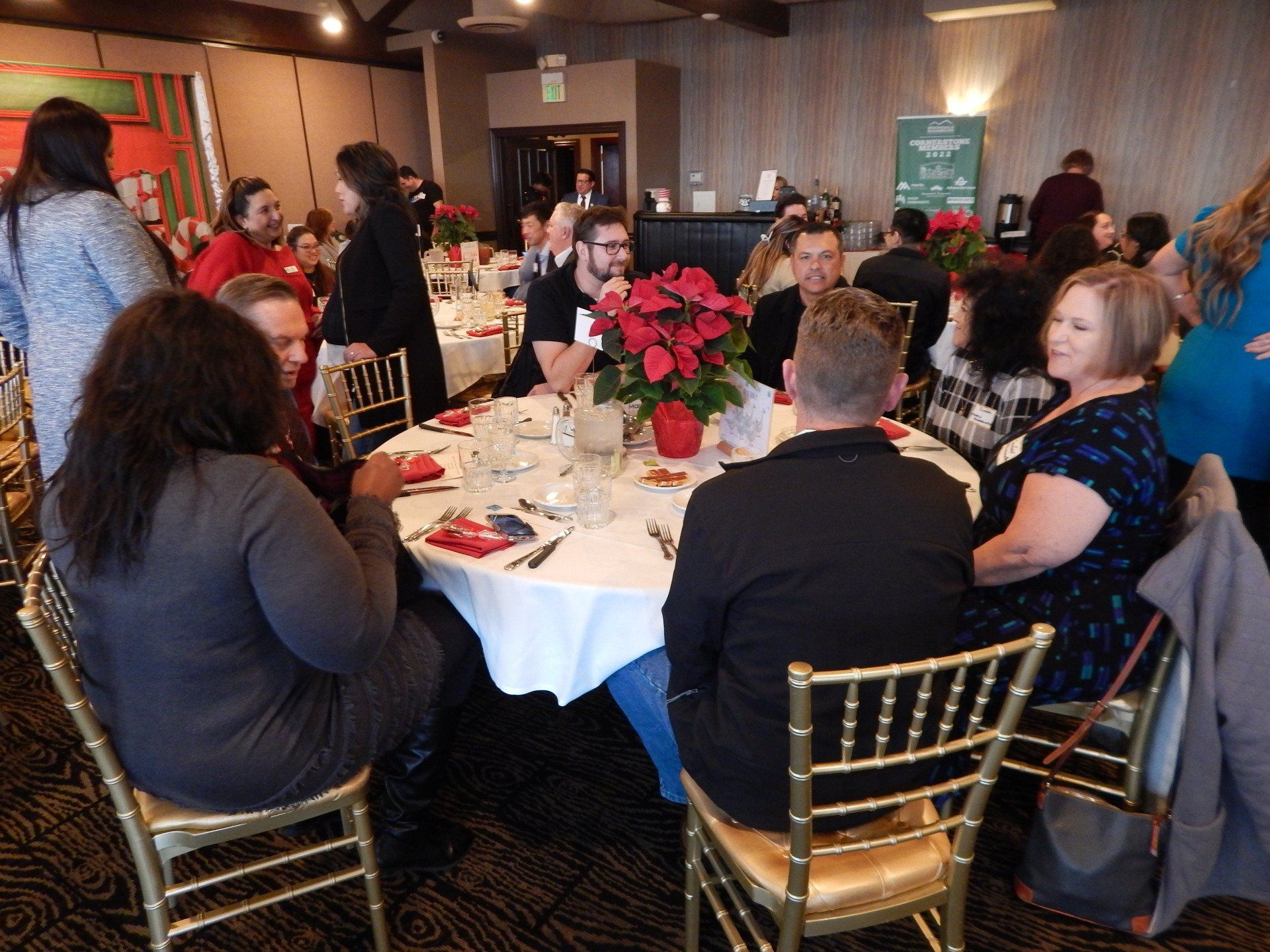 A group of people are sitting at tables in a room.