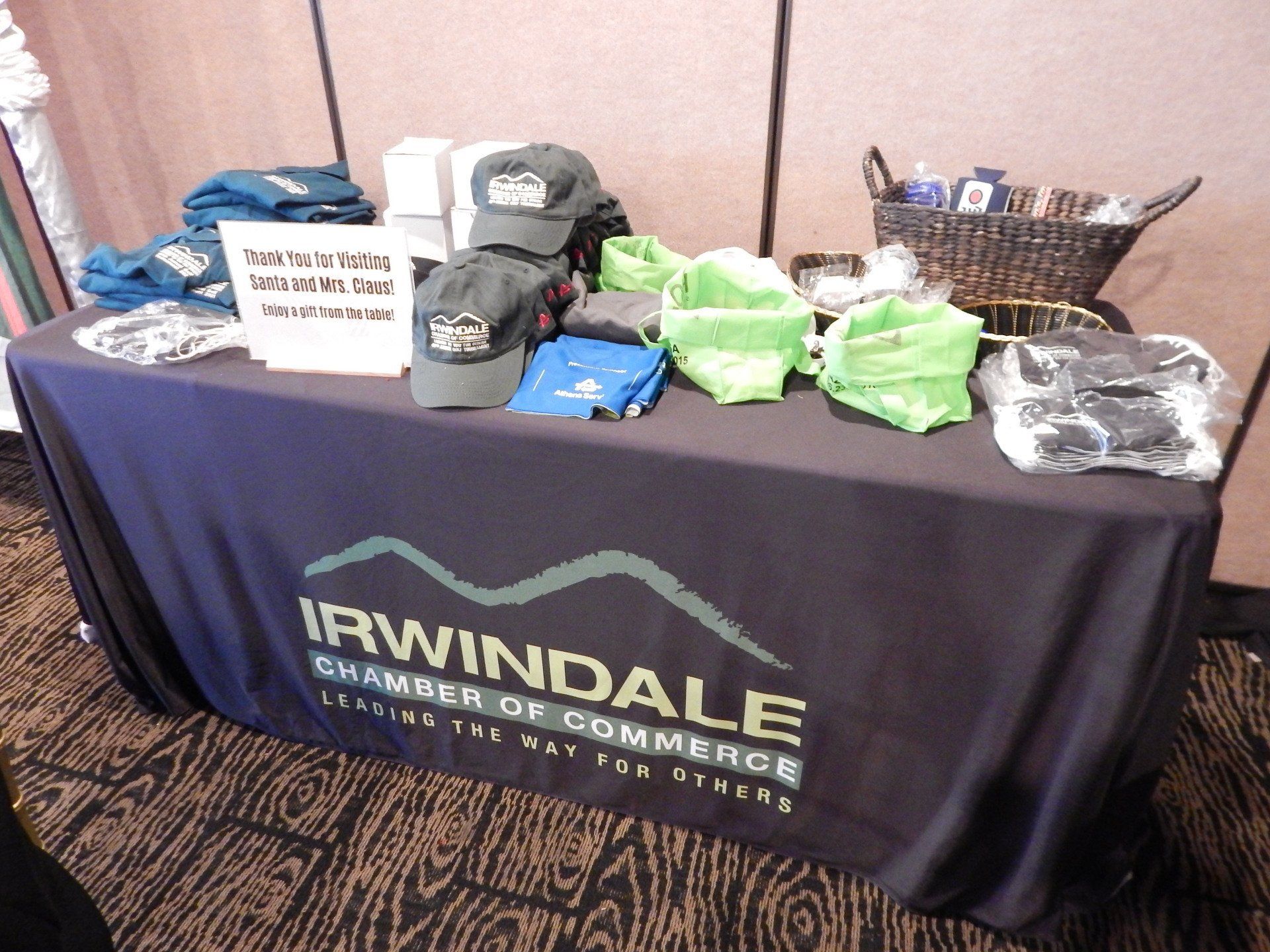 A table with a black table cloth that says irwindale chamber of commerce
