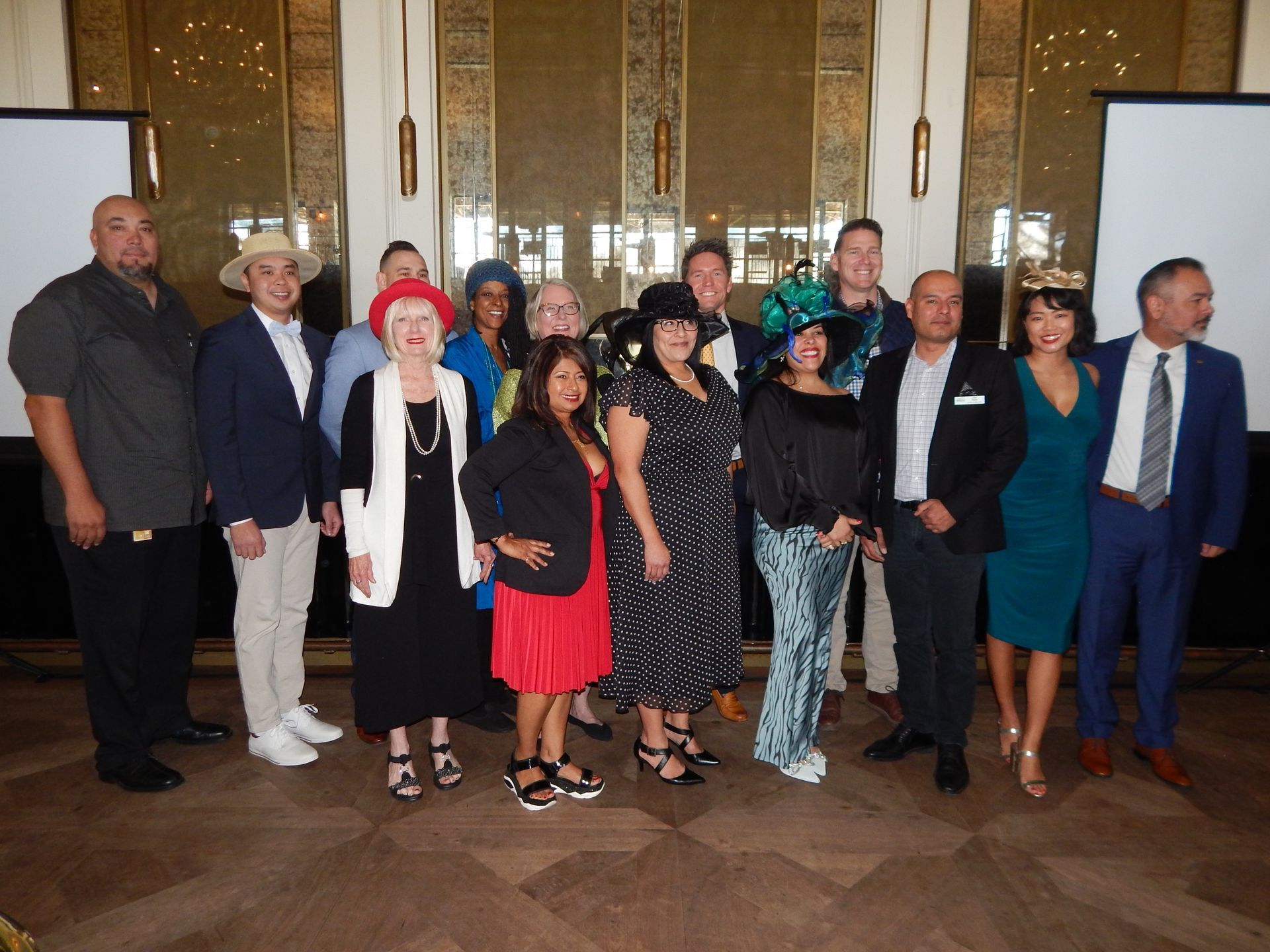 A group of people are posing for a picture in a room.