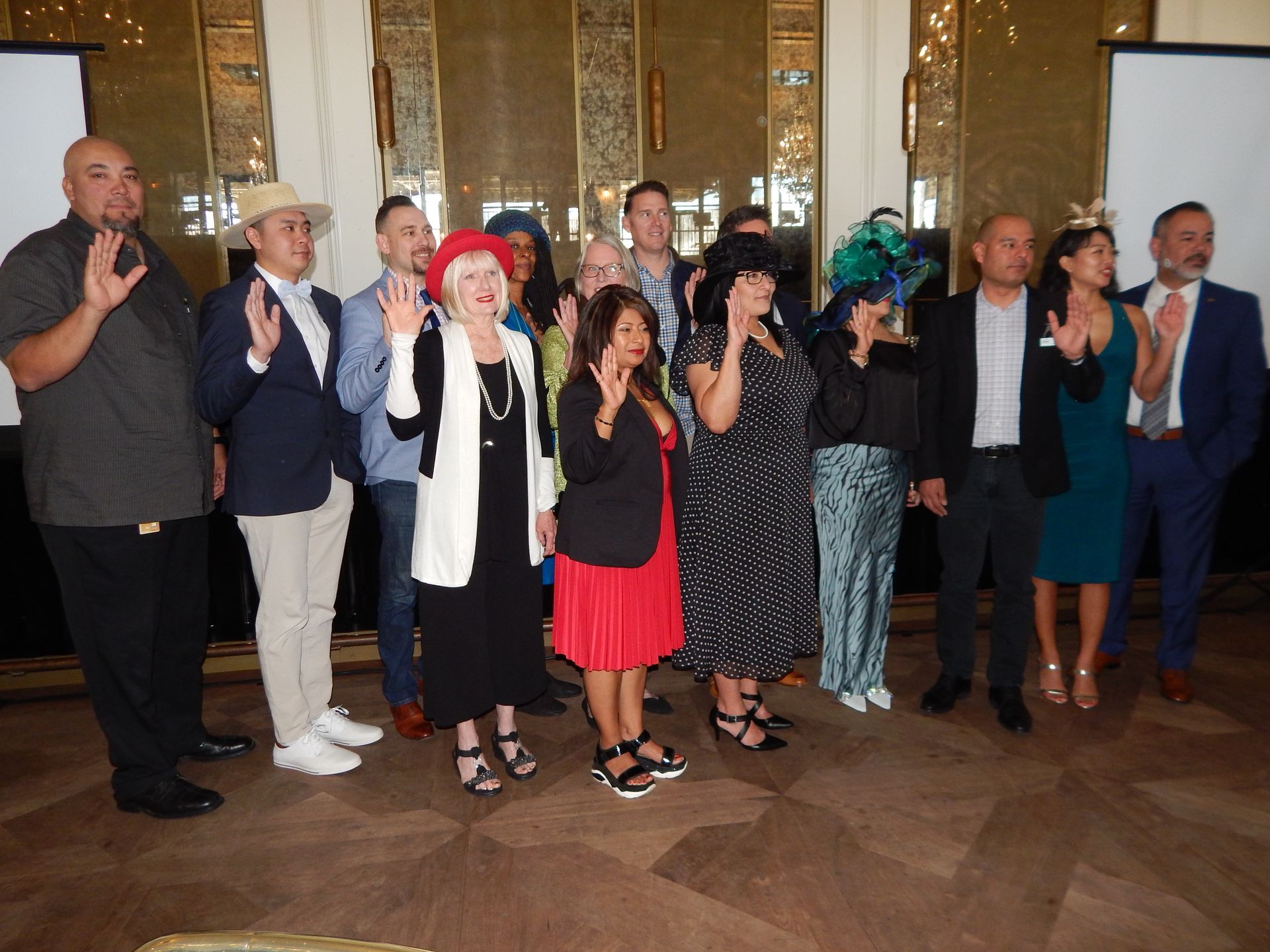 A group of people are posing for a picture in a room.