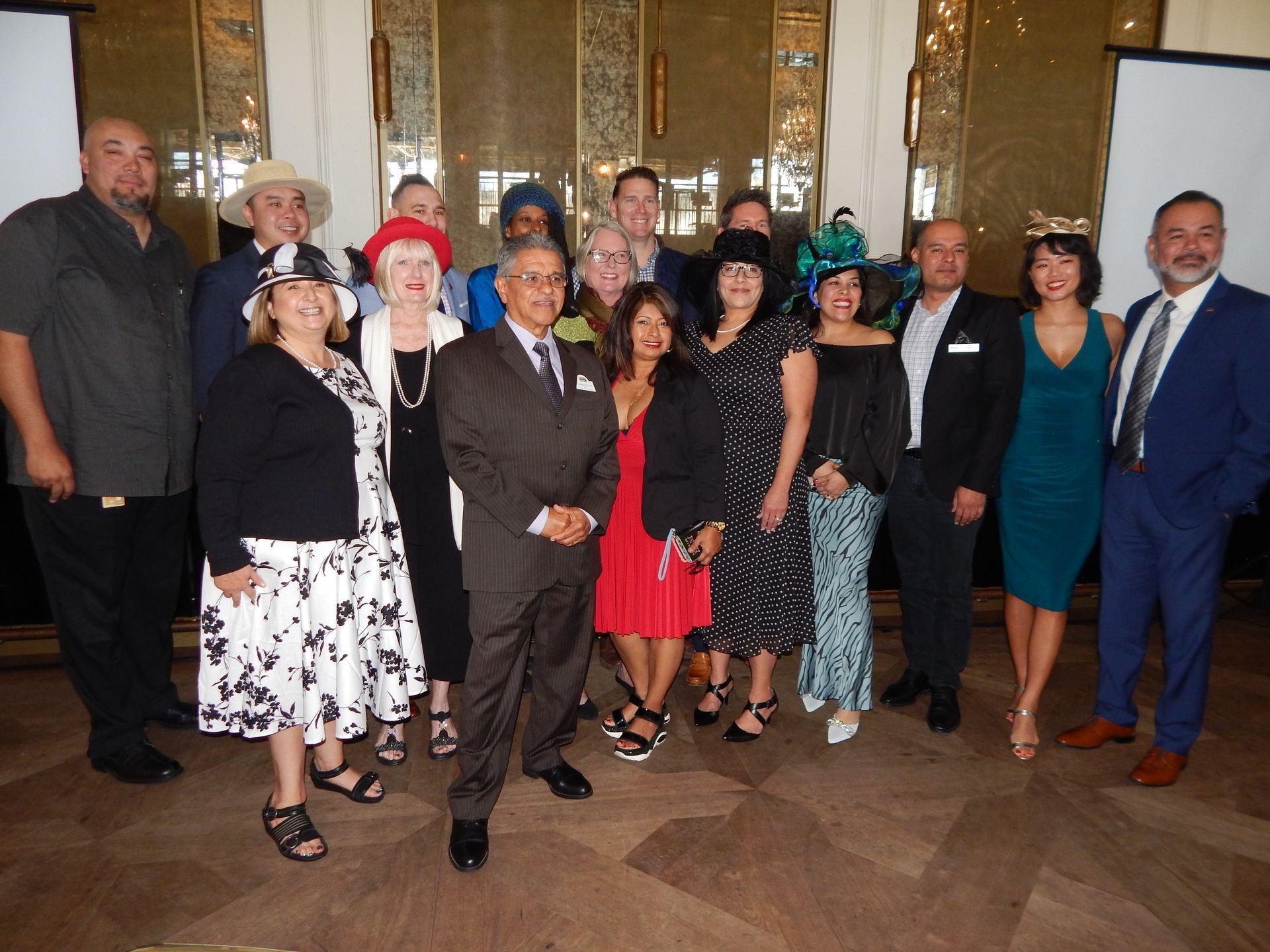 A group of people posing for a picture in a room