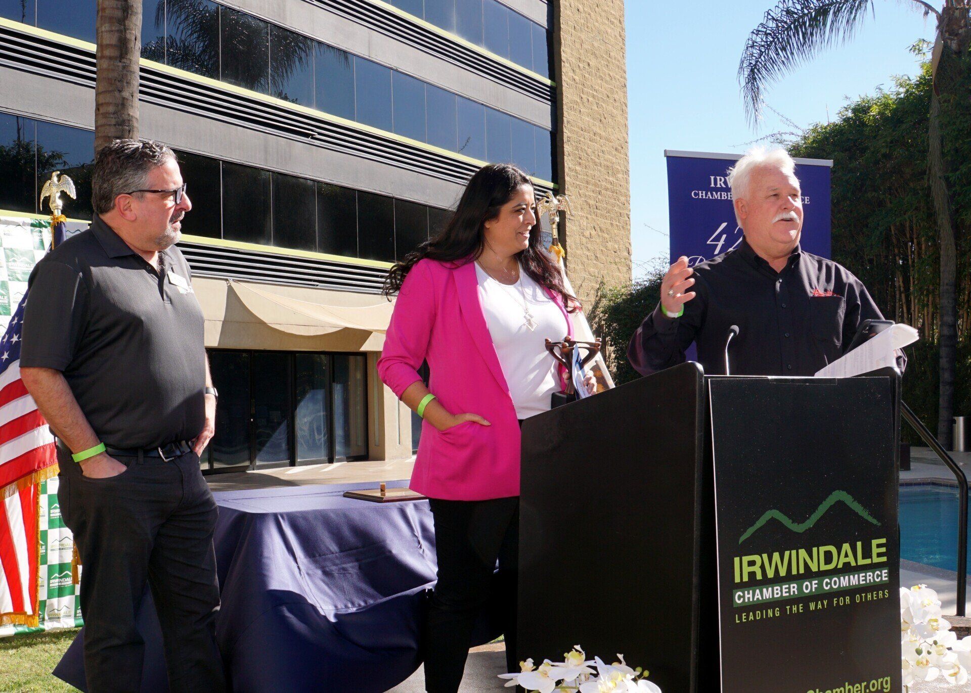 A man stands behind a podium that says irwindale
