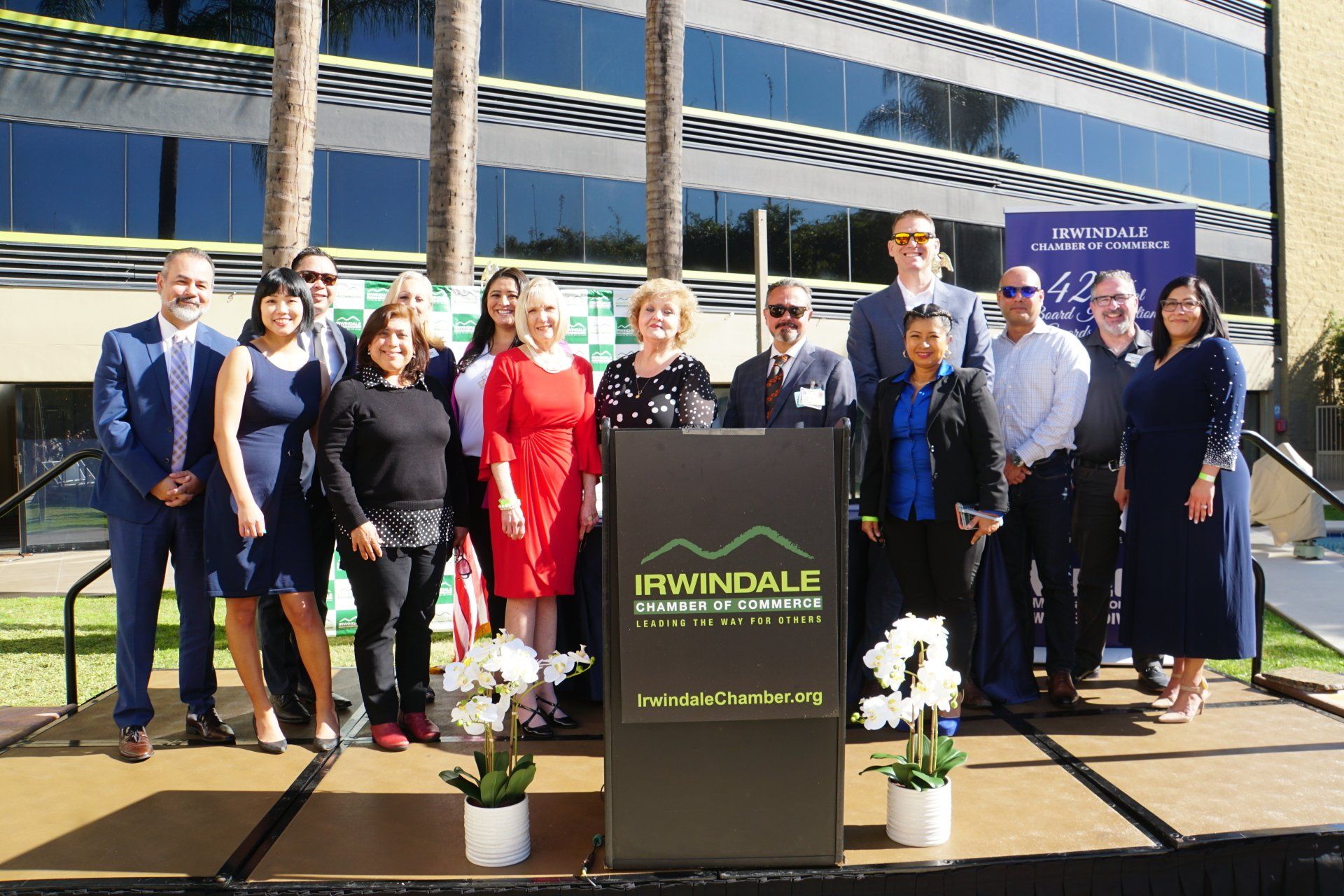 A group of people standing in front of a podium that says irondale