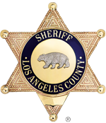 A los angeles county sheriff 's badge with a bear in the center