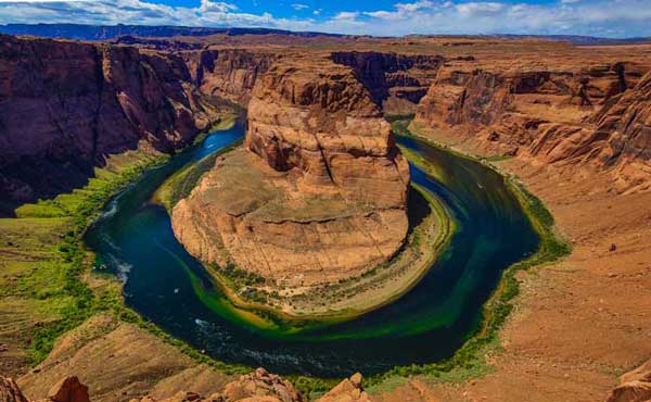 An aerial view of a river in the middle of a canyon.