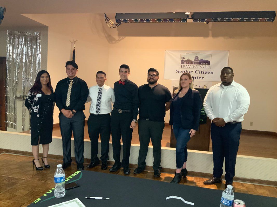 A group of people are posing for a picture in a room.