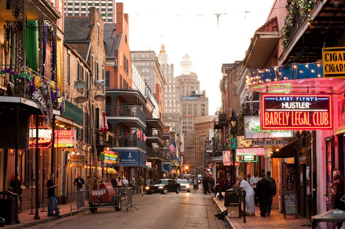 A city street with a sign that says barclay legal club