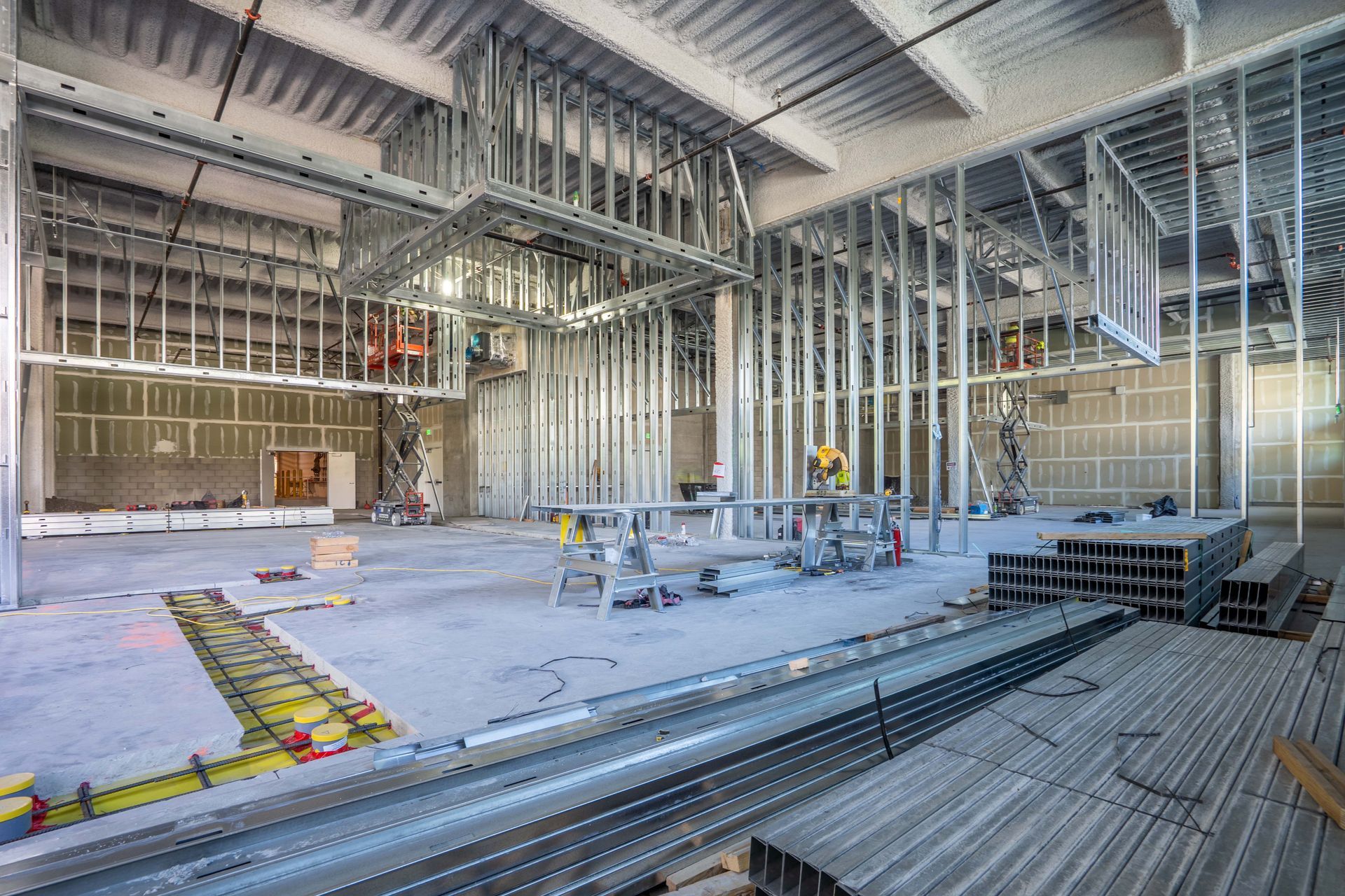 A large building under construction with a lot of metal frames.
