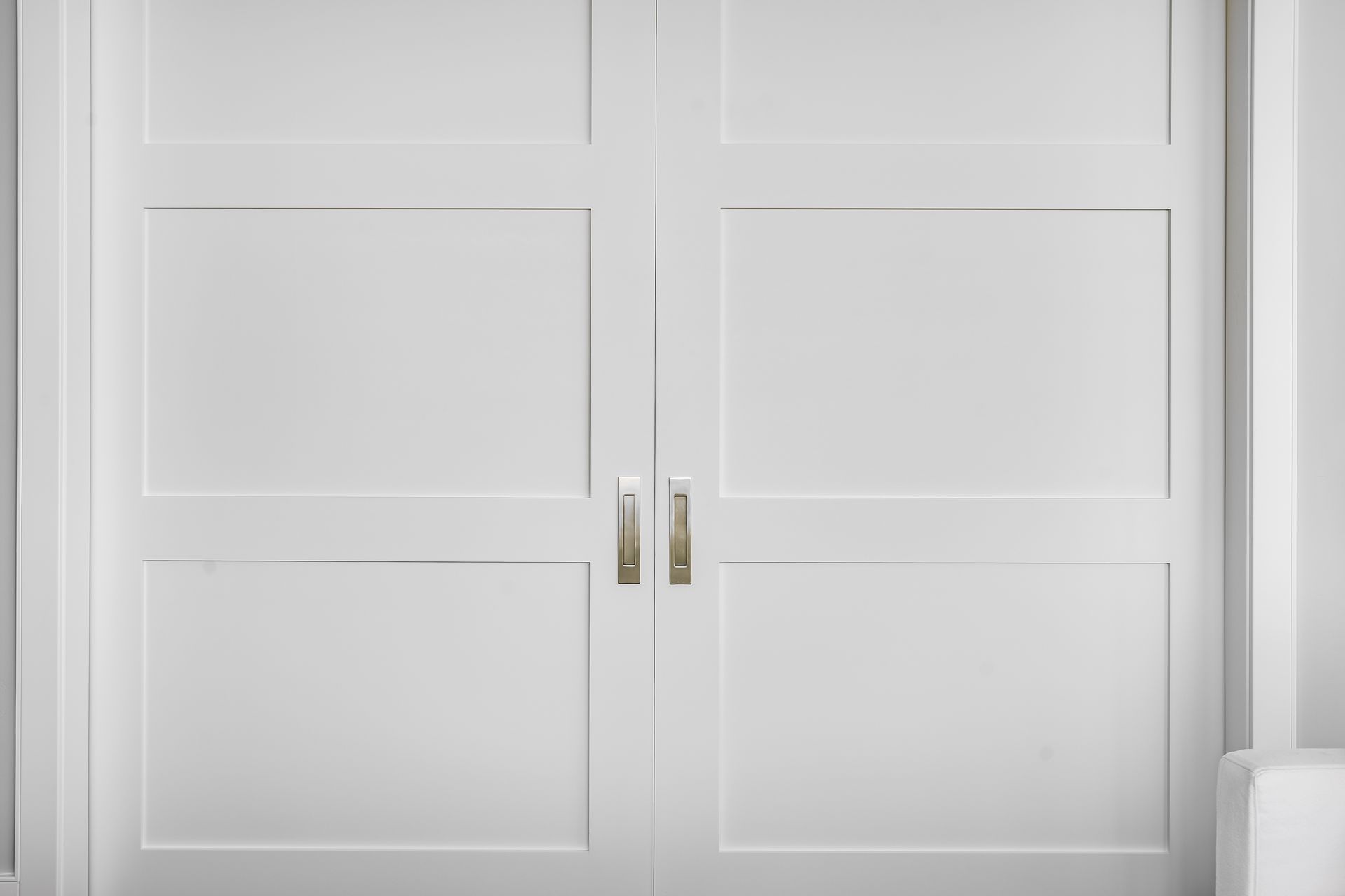 White double doors with silver handles.