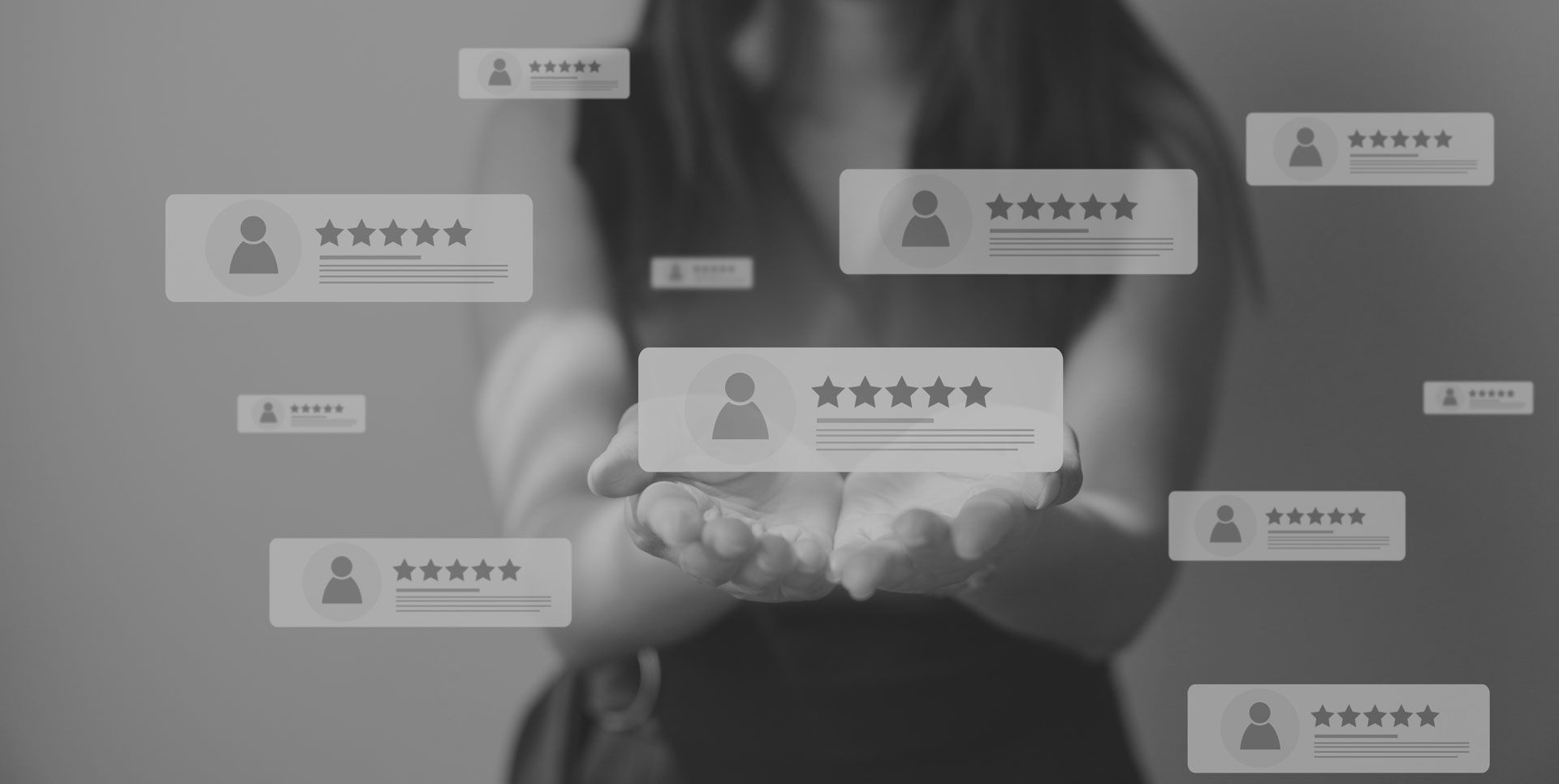 A woman is holding a box with a star rating on it in her hands.