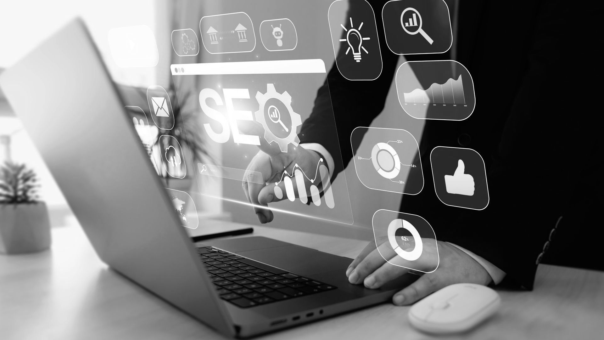 A person is using a laptop computer with a futuristic screen.