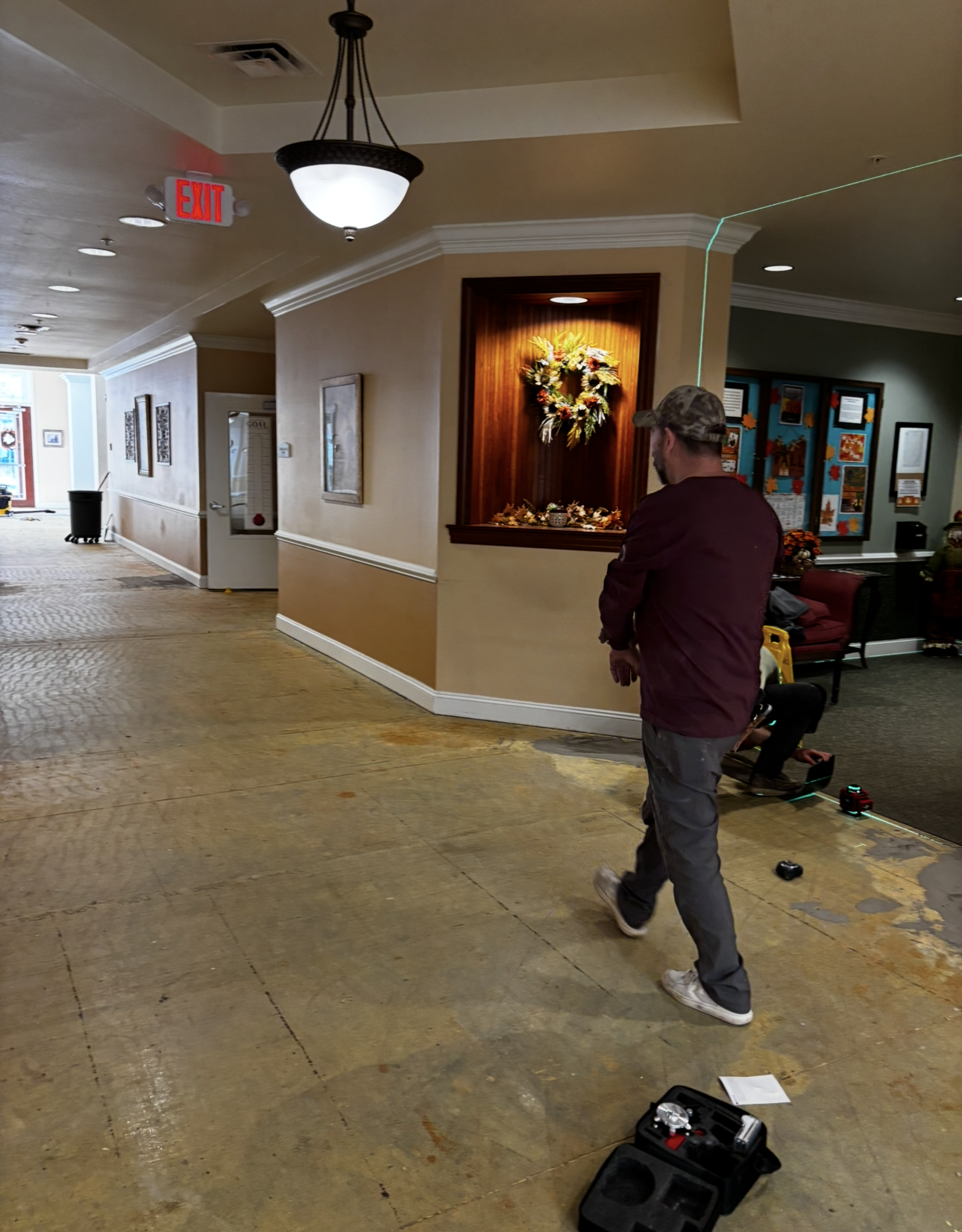 Swatches of wood, laminate, and solid surface samples, arranged on a light wood surface.
