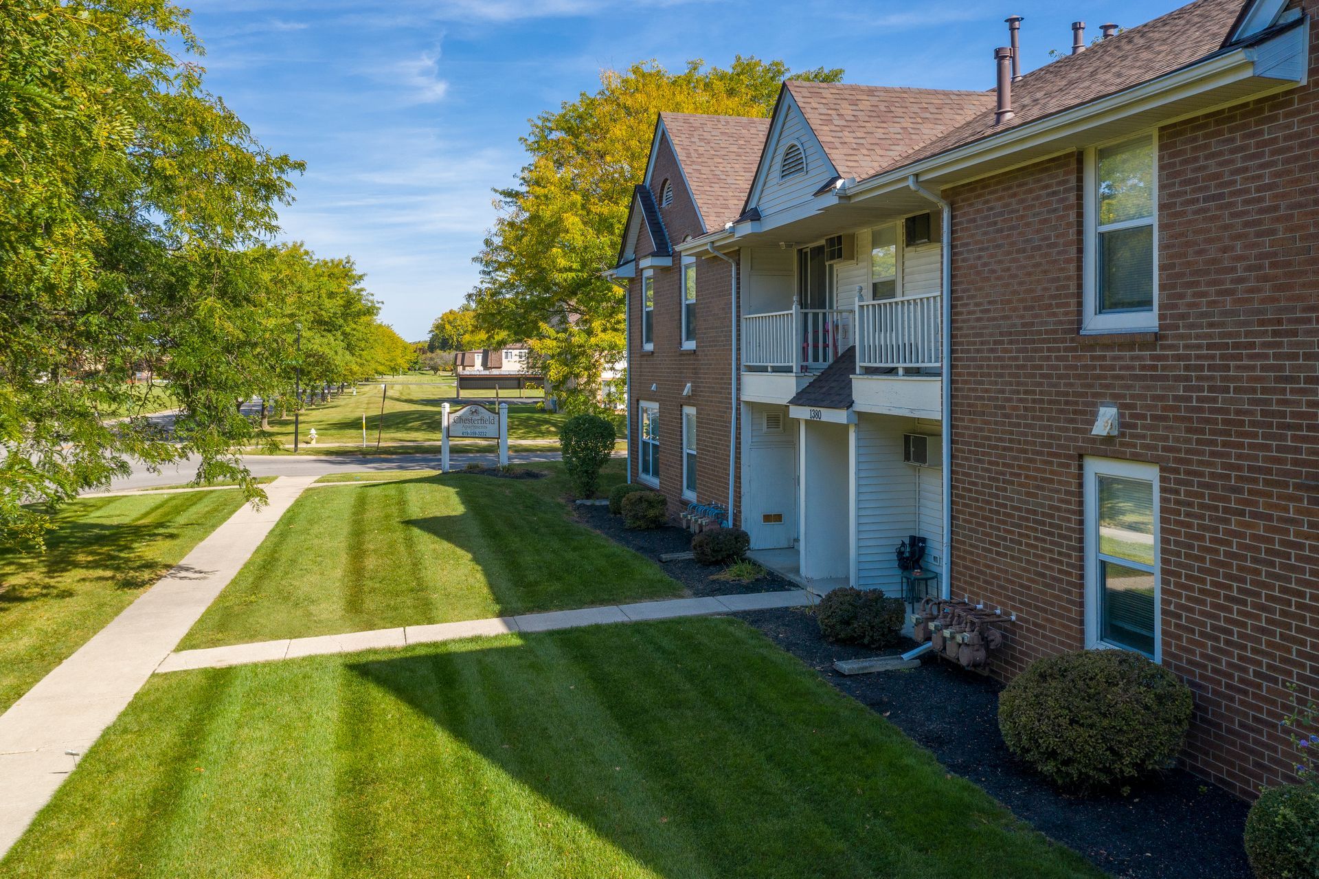 Photo of a two-story building, showing the lawn out front