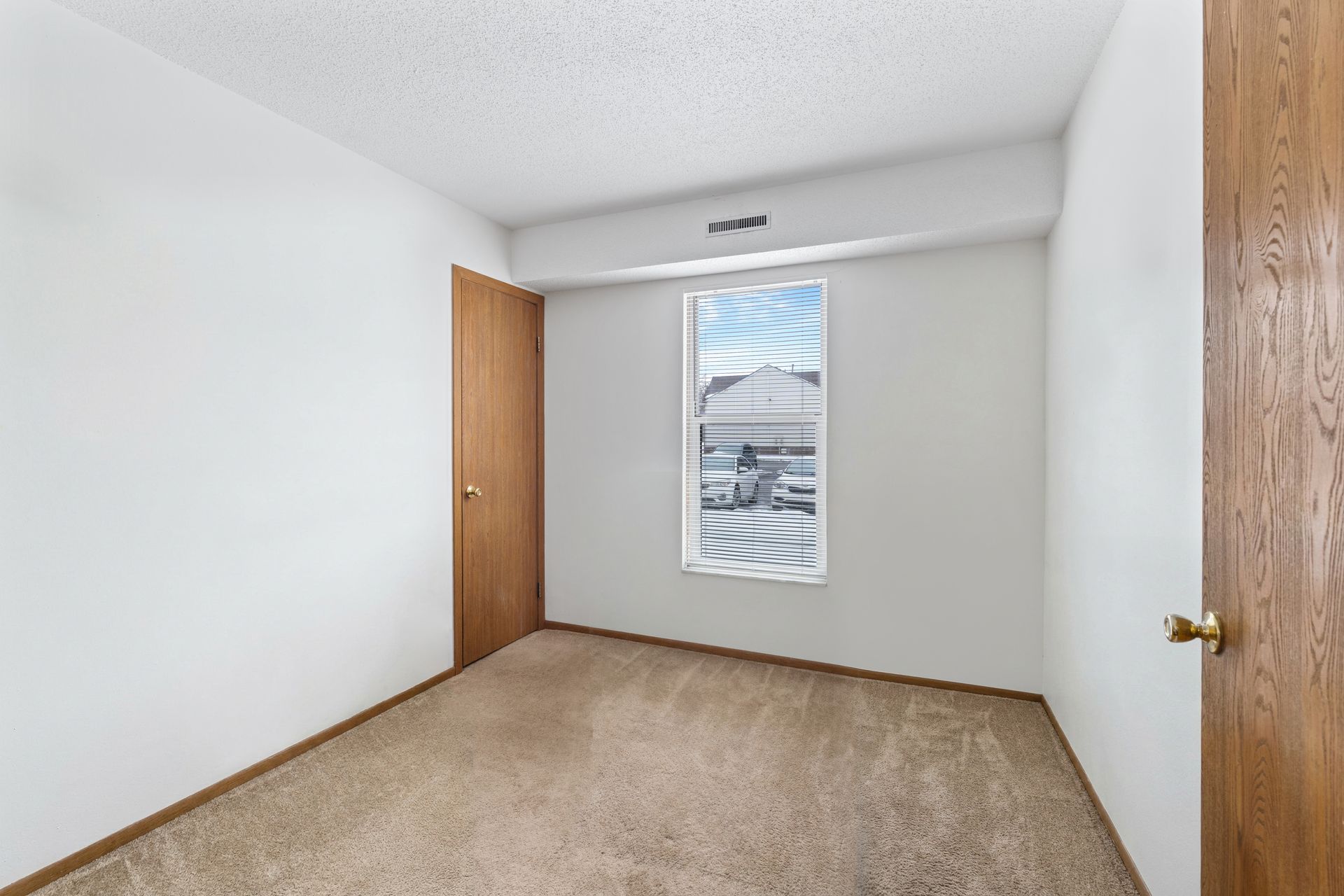 Photo of a room with a tall window