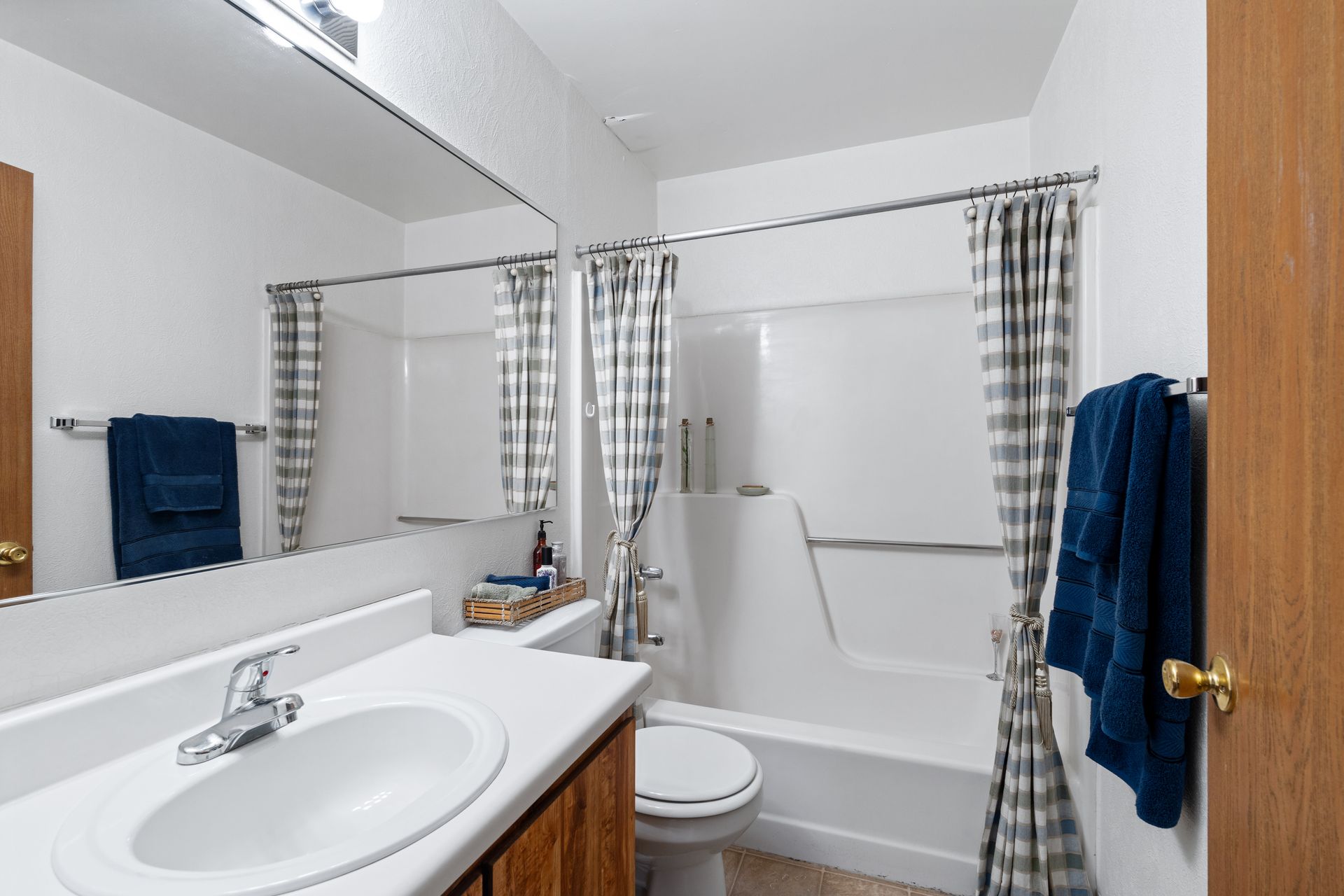 Photo of a bathroom with a bathtub/shower combination