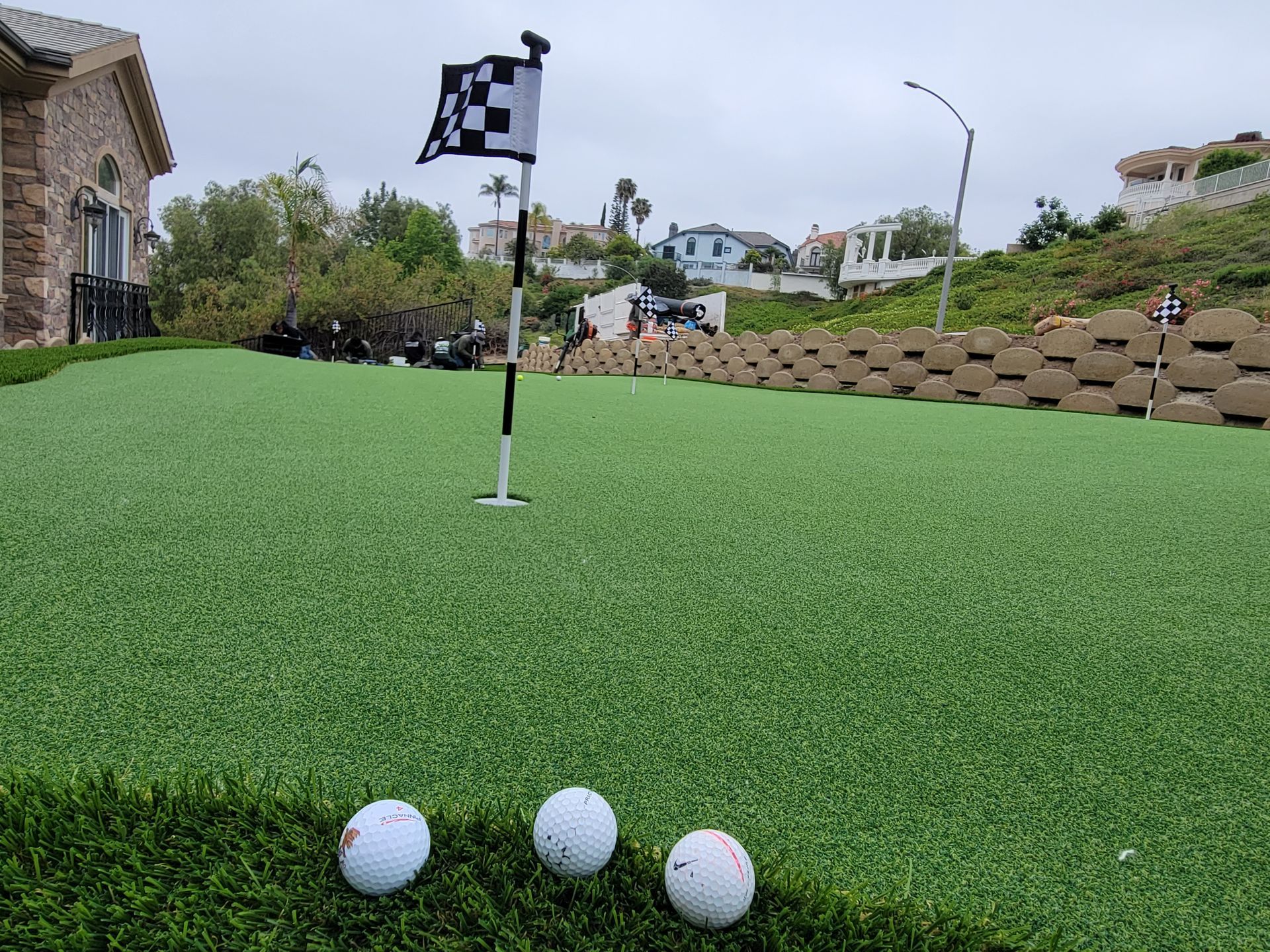 artificial putting green and flag