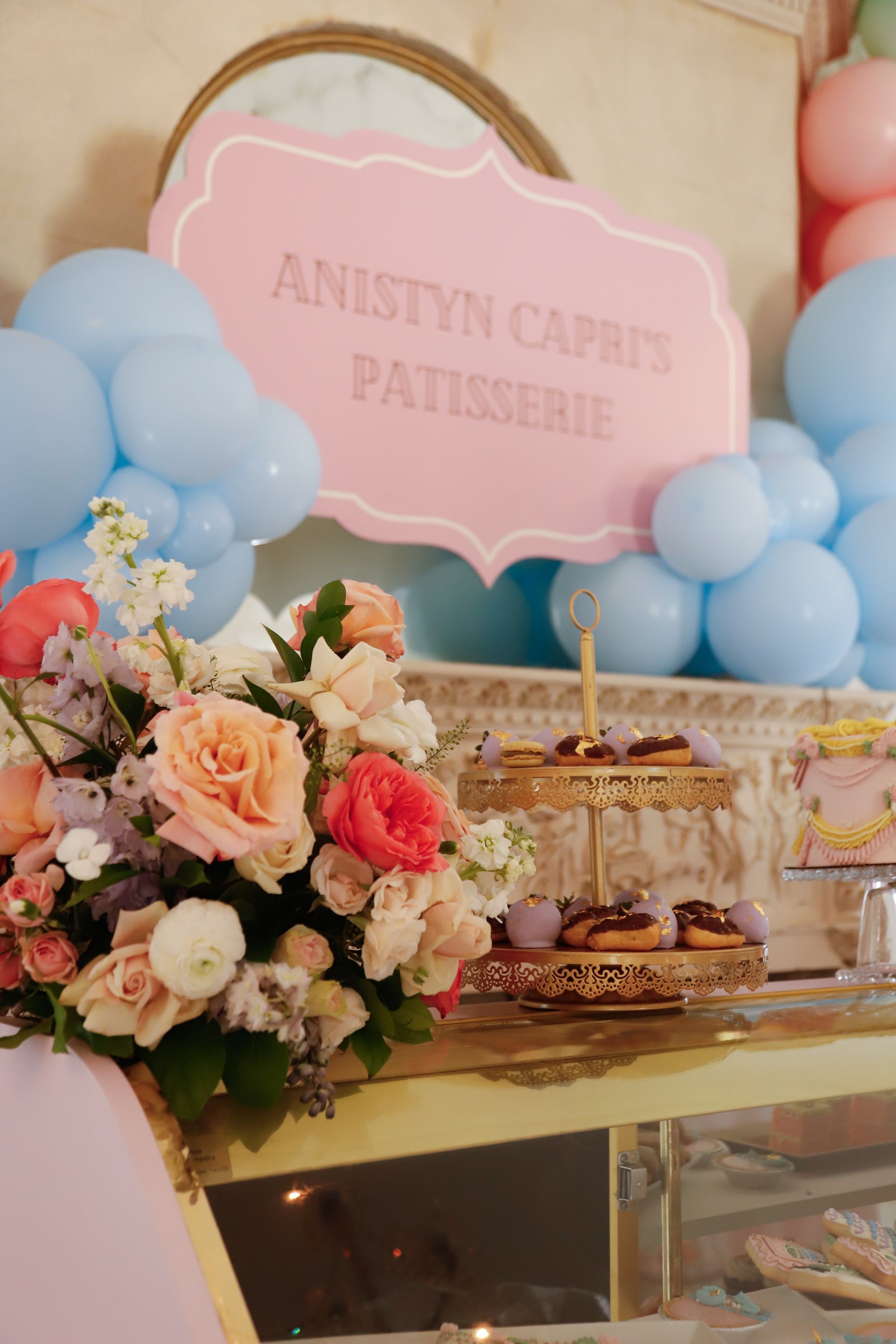 Pink and blue themed dessert table. A sign reads 