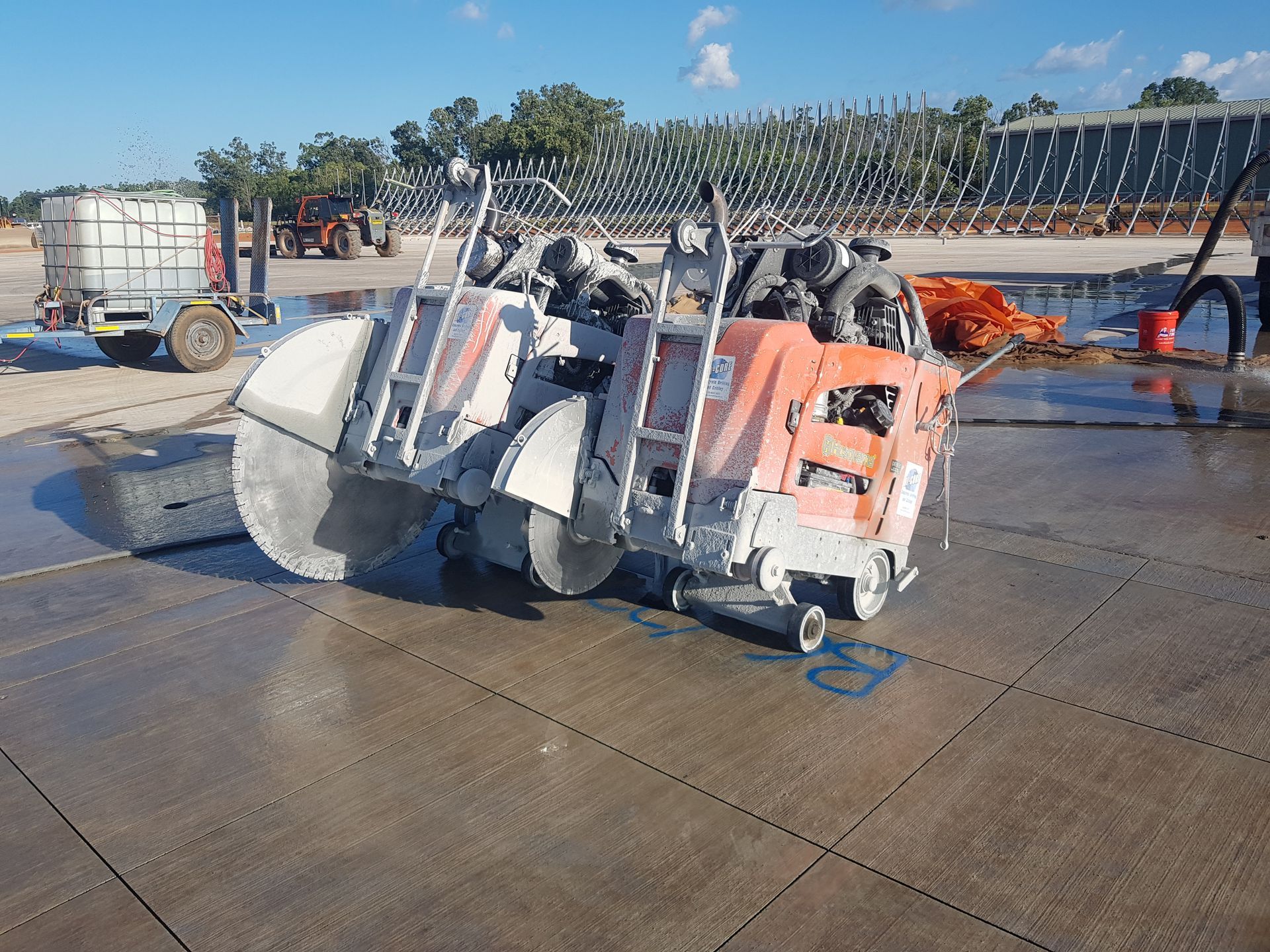A concrete saw cutting a grid pattern into a gray concrete surface — Di-Core Drilling and Cutting in Darwin, NT