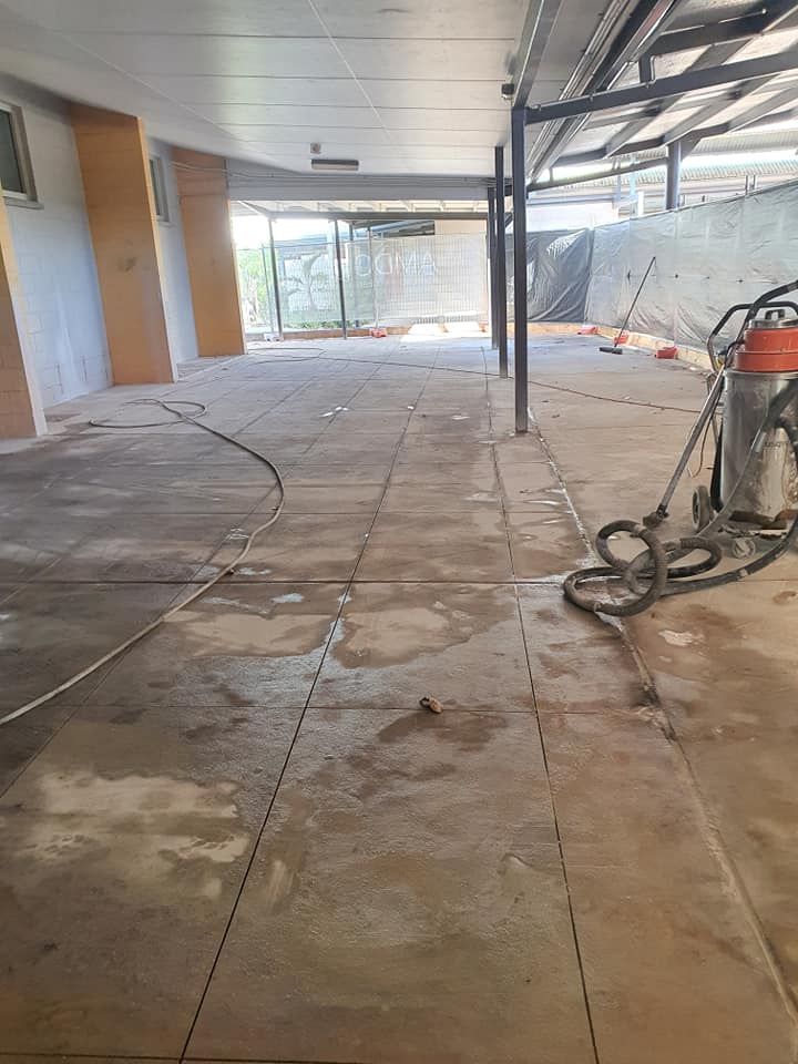 A Vacuum Cleaner is Sitting on the Floor of a Building — Di-Core Drilling and Cutting in Darwin, NT