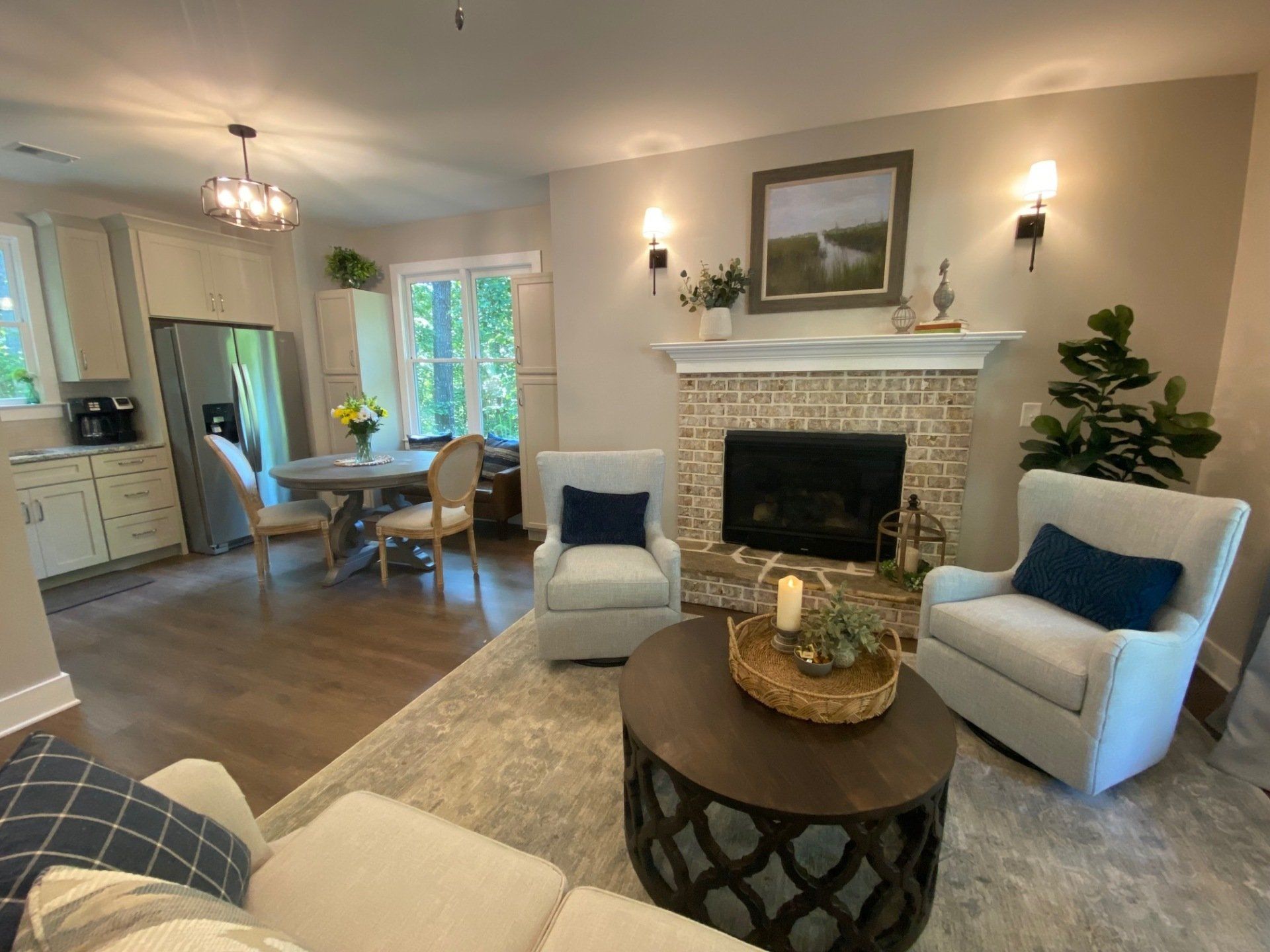 A living room filled with furniture and a fireplace.