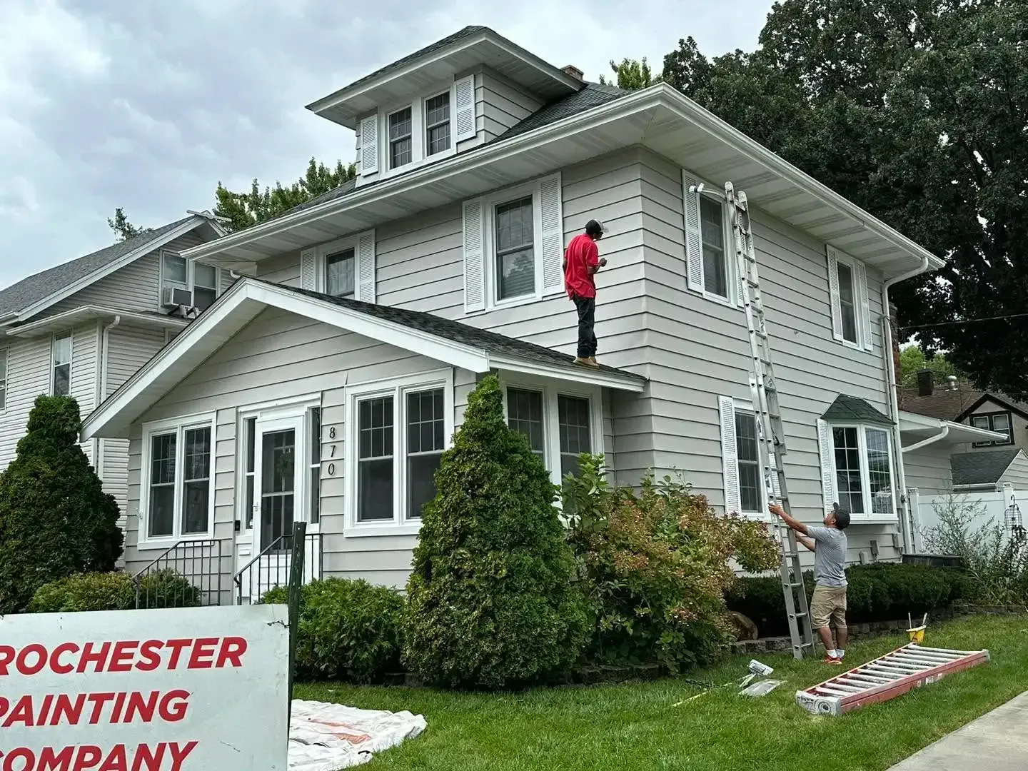 Commercial painters in Rochester, MN painting the side of a building.