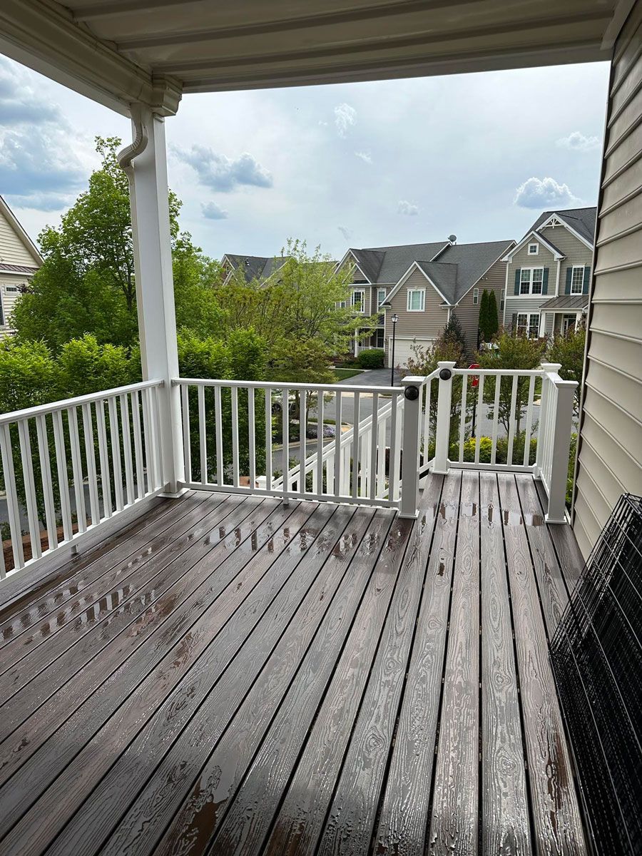 Wooden Deck with a White Railing — Brookeville, MD — Smooth Bore Pressure Washing LLC
