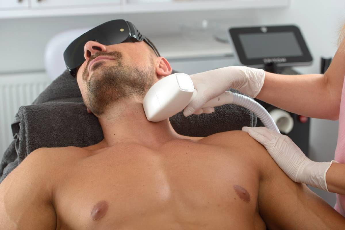 Someone receiving laser tattoo removal on their neck and face near Lexington, Kentucky (KY)