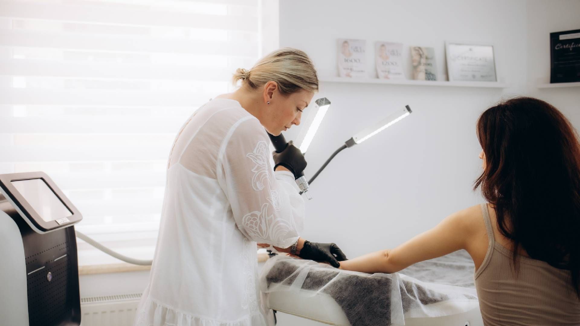 A patient and specialist during a laser tattoo removal appointment near Lexington, Kentucky (KY)
