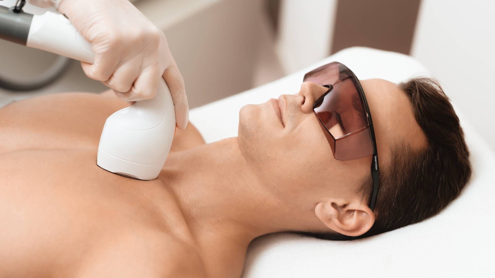 Someone receiving laser hair removal for their neck and chest near Lexington, Kentucky (KY)