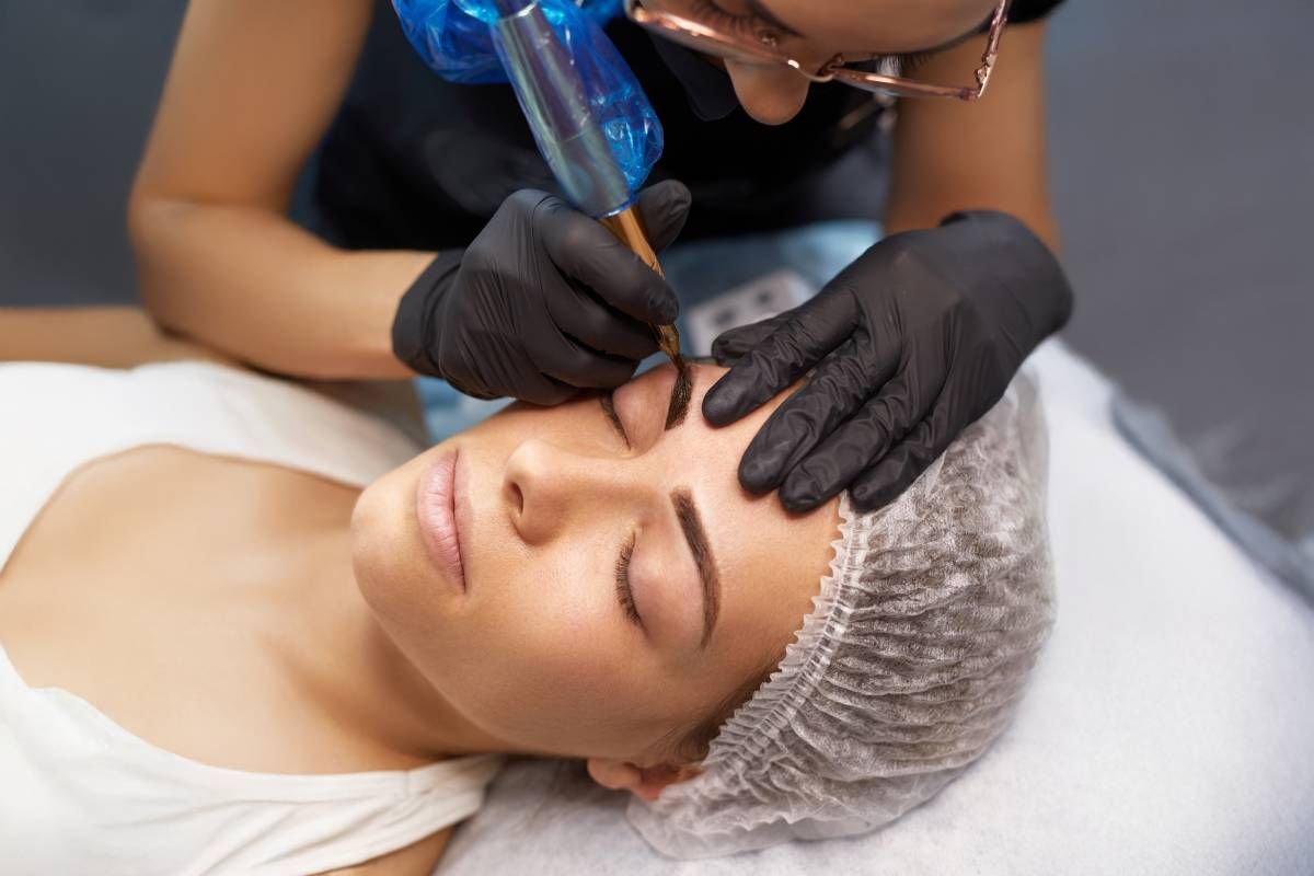 Someone receiving a laser microblading removal treatment near Lexington, KY