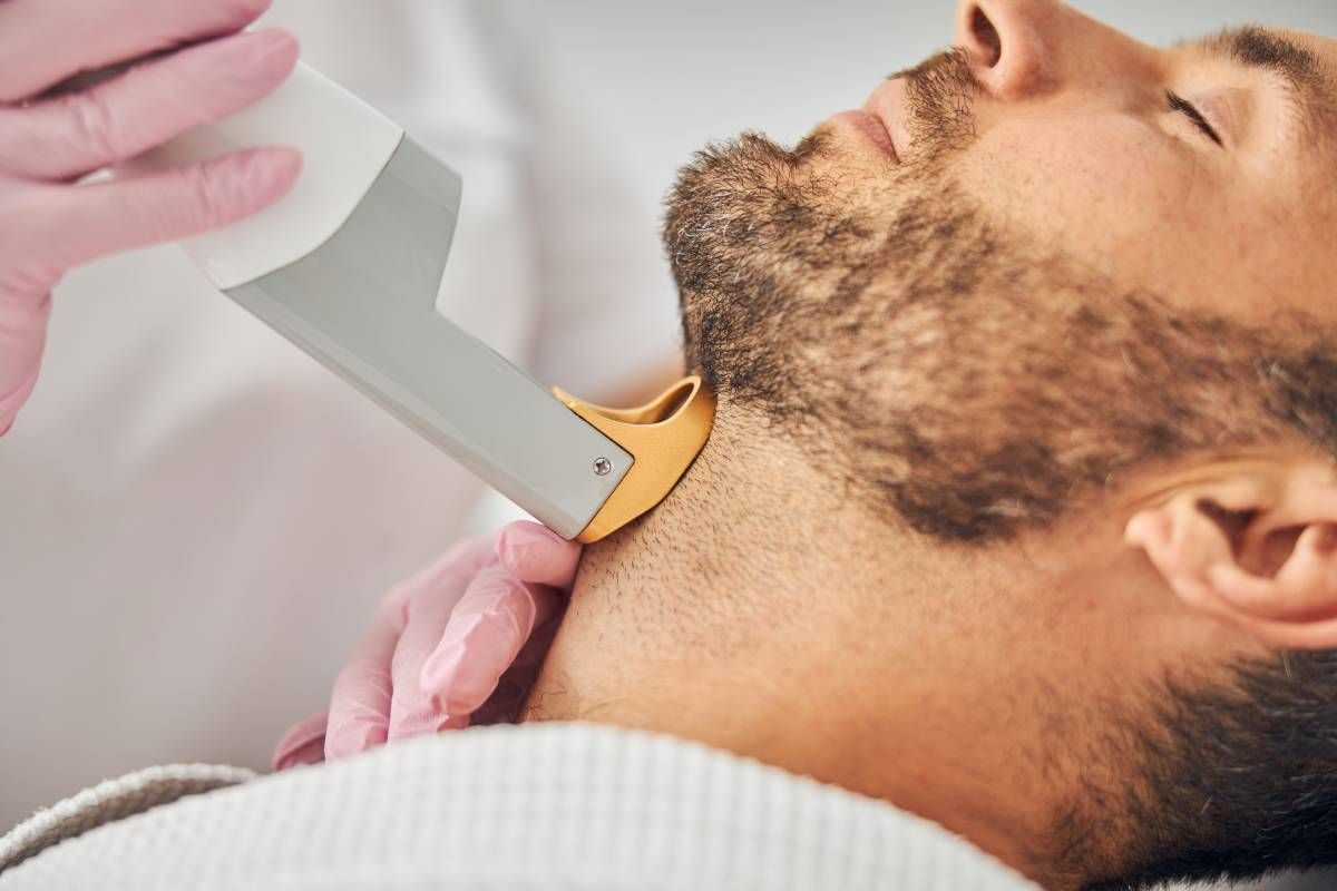 Someone receiving a laser hair removal treatment during a session at Lexington Tattoo Removal near Lexington, KY