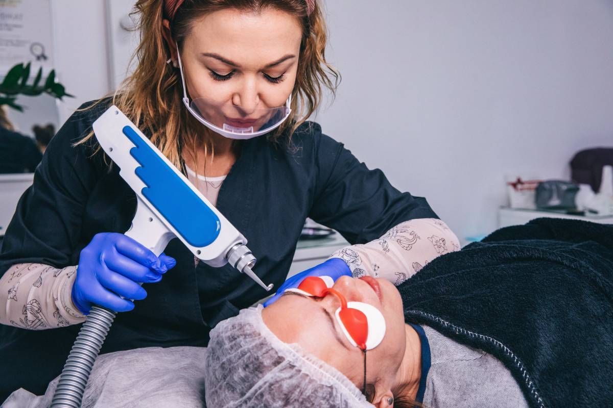 A laser removal specialist helps a patient through microblading removal in Lexington, Kentucky (KY)
