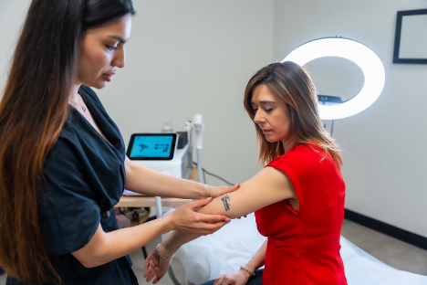 Woman consulting a specialist for tattoo removal treatment.
