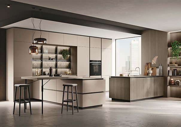 Una cucina con una grande isola e sgabelli