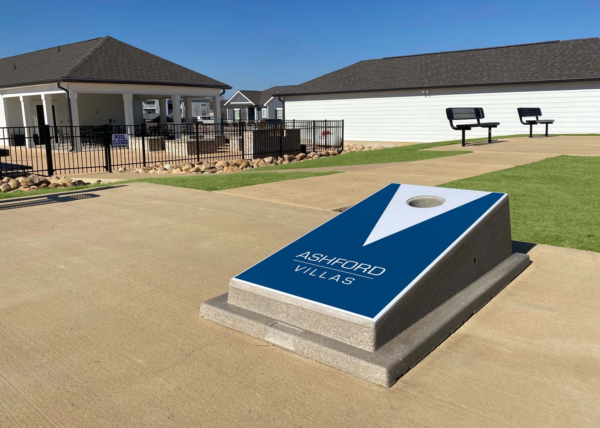 A blue and white cornhole board with a hole in the middle at Ashford Villas in Chattanooga, TN.