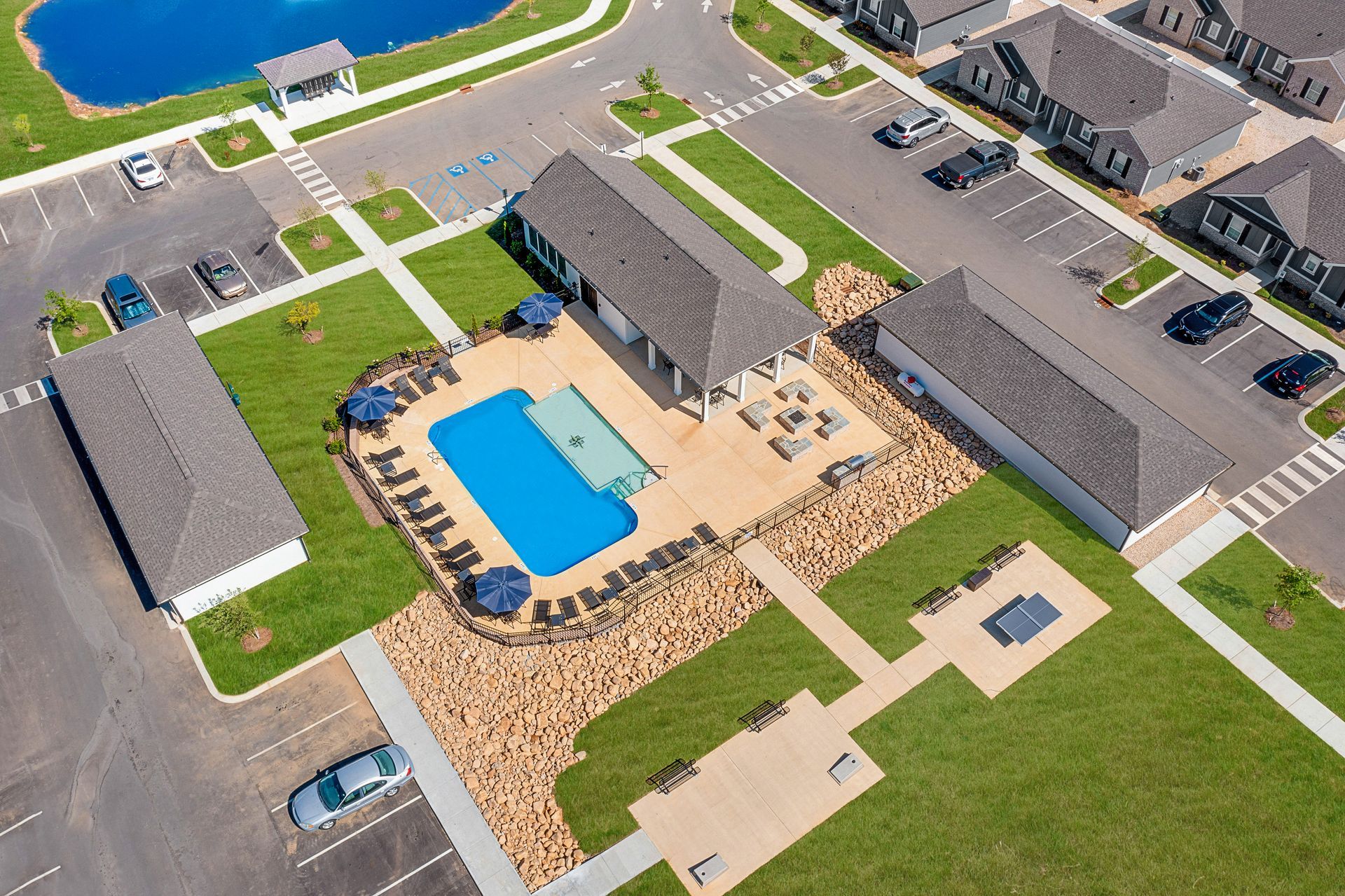 An aerial view of a residential area with a large swimming pool in the middle at Ashford Villas in Chattanooga, TN.