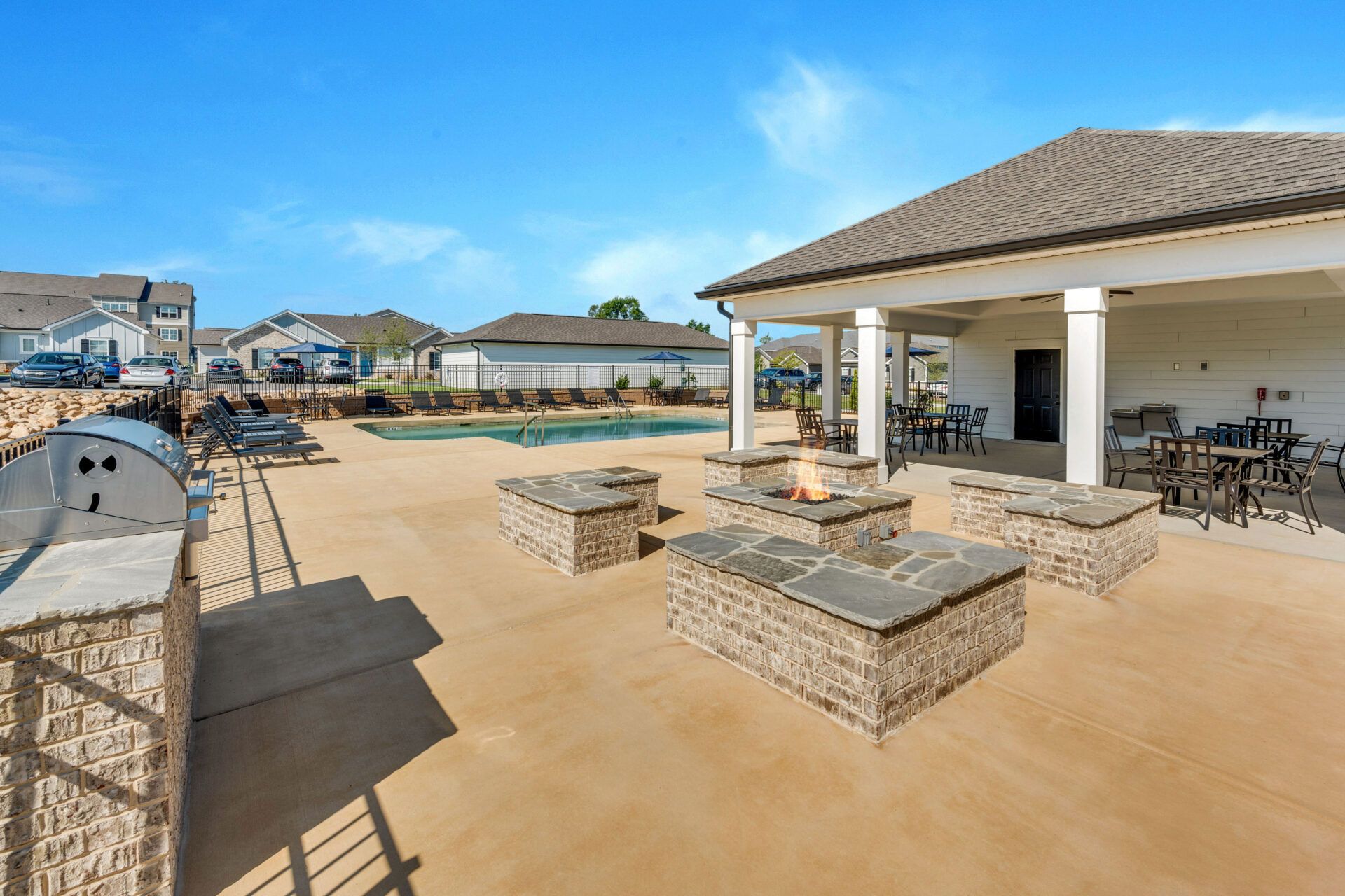 There is a fire pit in the middle of the patio area at Ashford Villas in Chattanooga, TN.