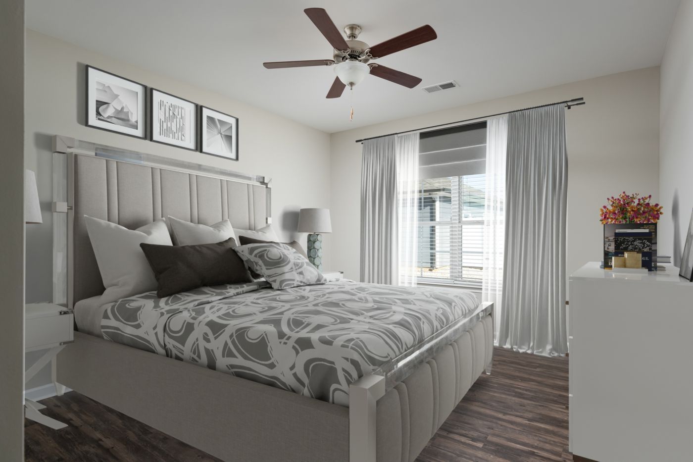 A bedroom with a large bed and a ceiling fan at Ashford Villas in Chattanooga, TN.