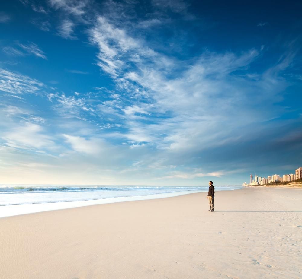 A Man is Standing on a Beach Looking at the Ocean — NLJ Partners P/L In Wyong, NSW