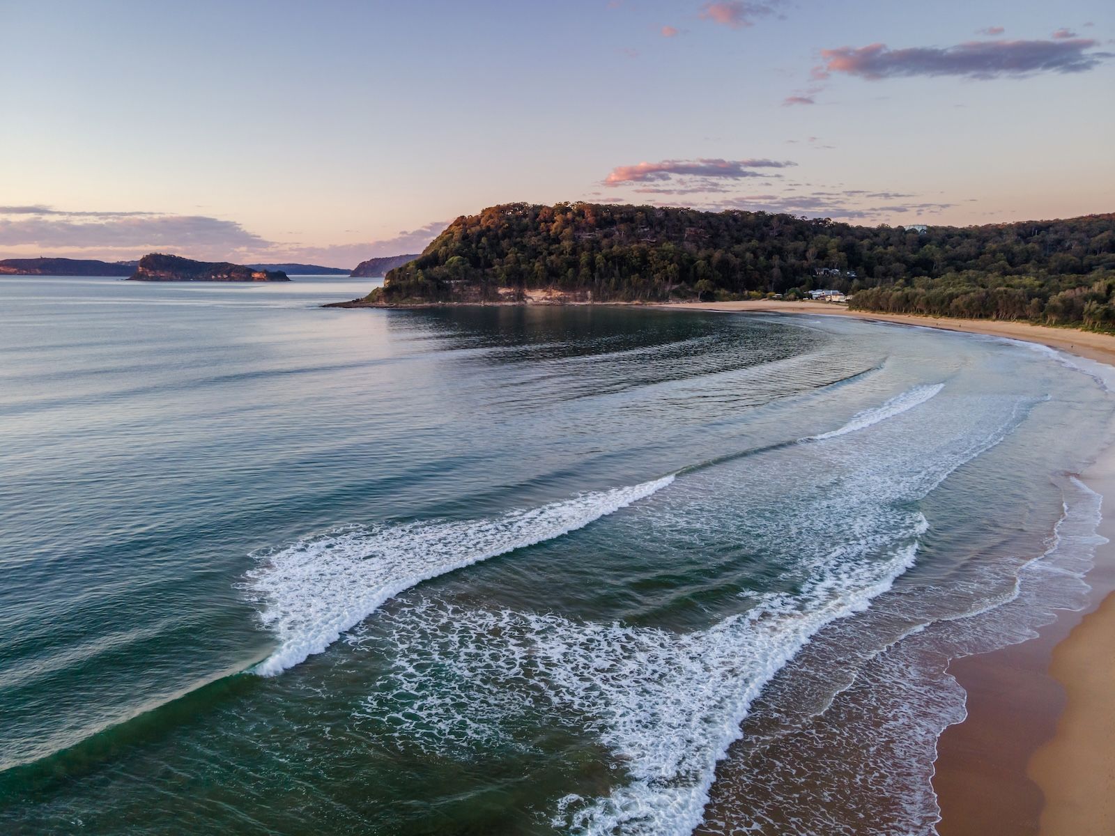 An Aerial View of a Beach With Waves Crashing on the Shore — NLJ Partners P/L In Wyong, NSW