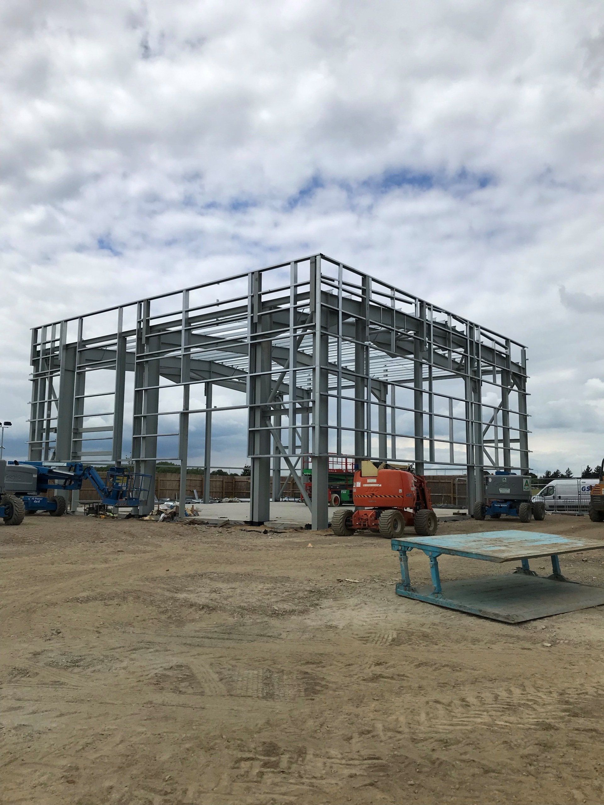 A large steel portal frame in construction