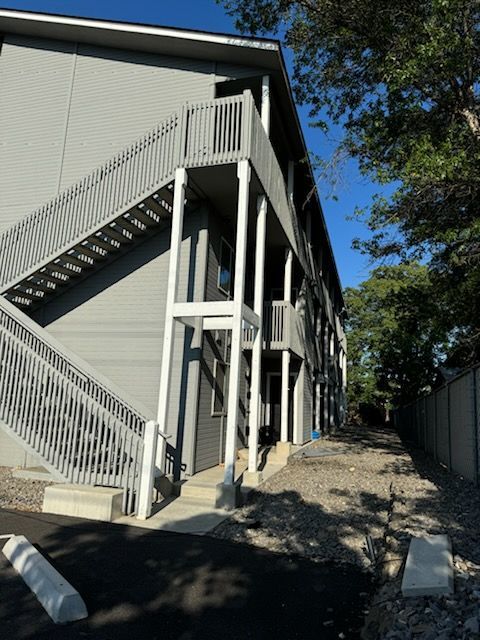 A building with stairs leading up to the second floor