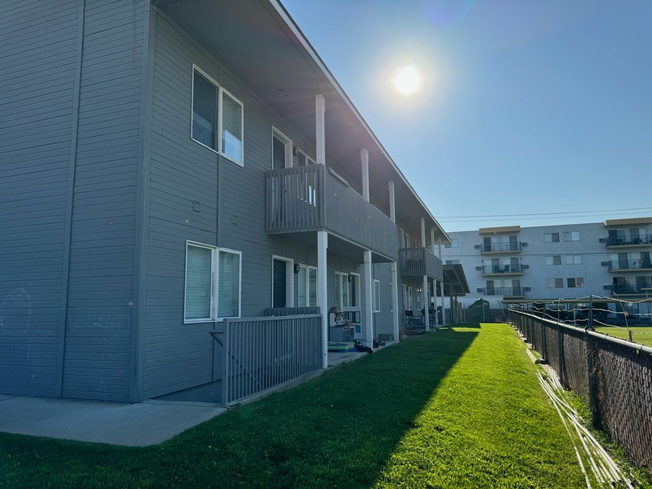 A large apartment building with a lot of windows and balconies