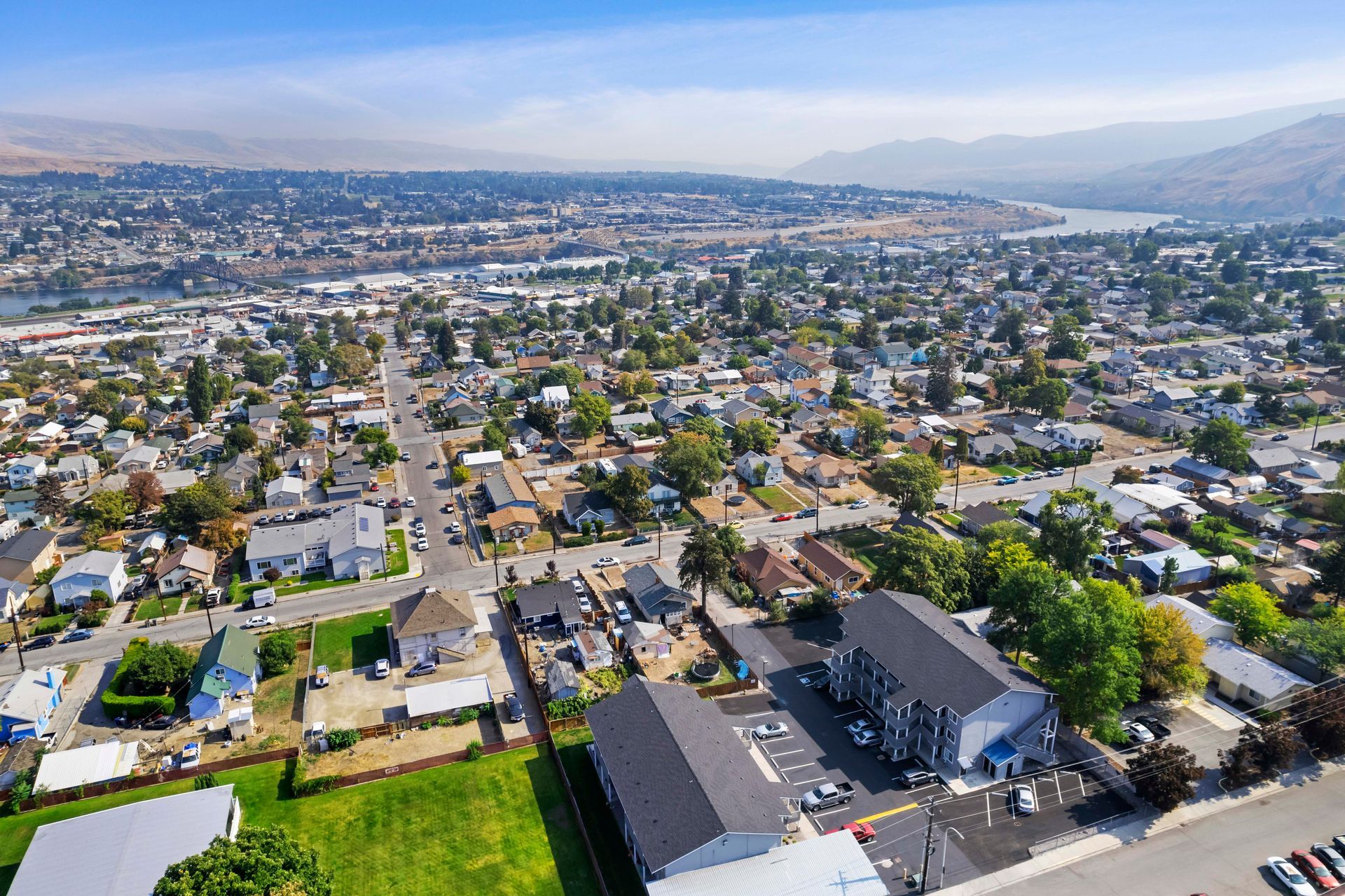 An aerial view of a city with a lot of houses and trees