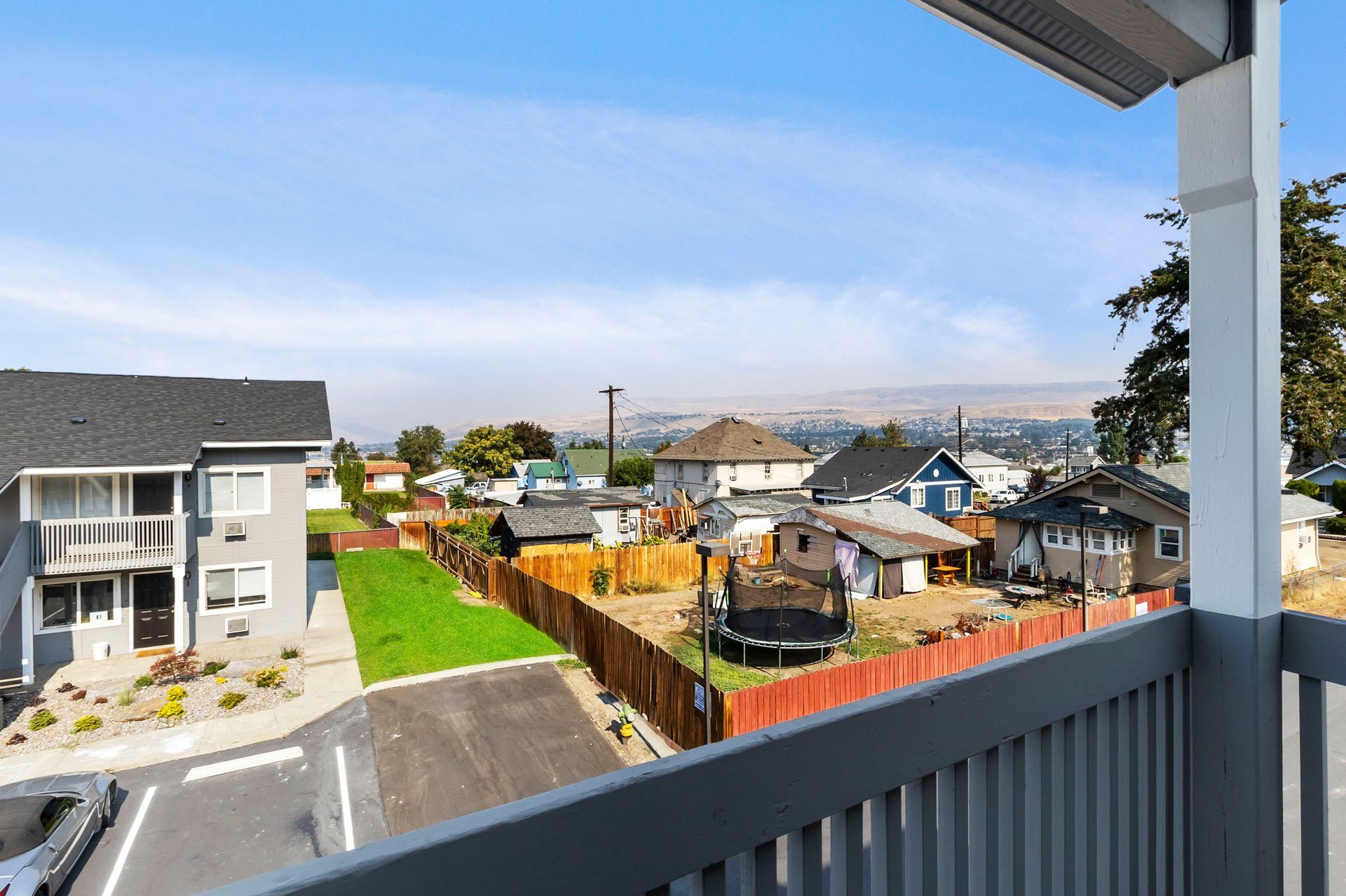A view of a residential neighborhood from a balcony.